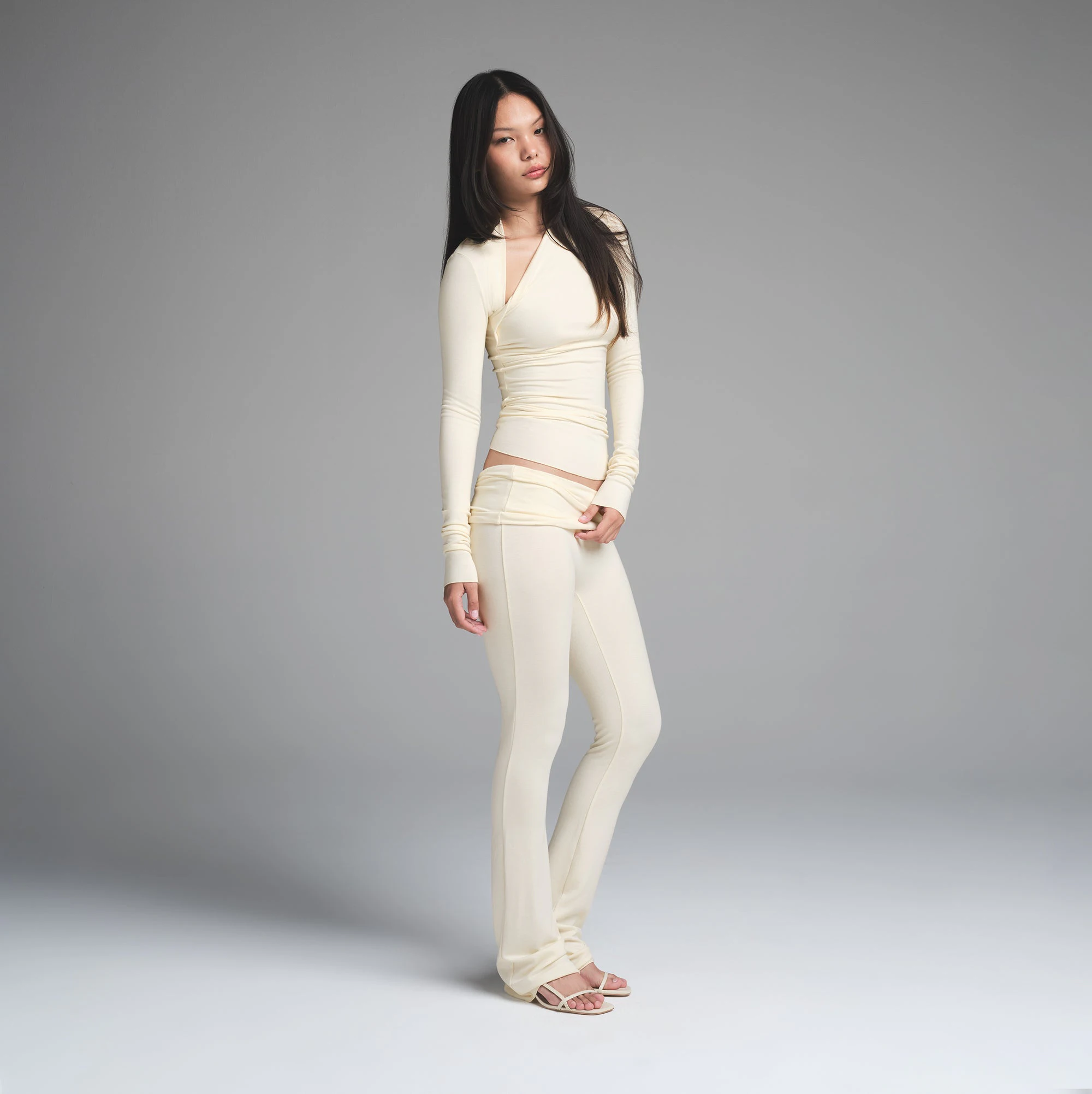 SKIMS CLOUD FOLDOVER PANT | ECRU ON A MODEL SIDE VIEW | FOCUS: 0.0, 1.0, 0.9