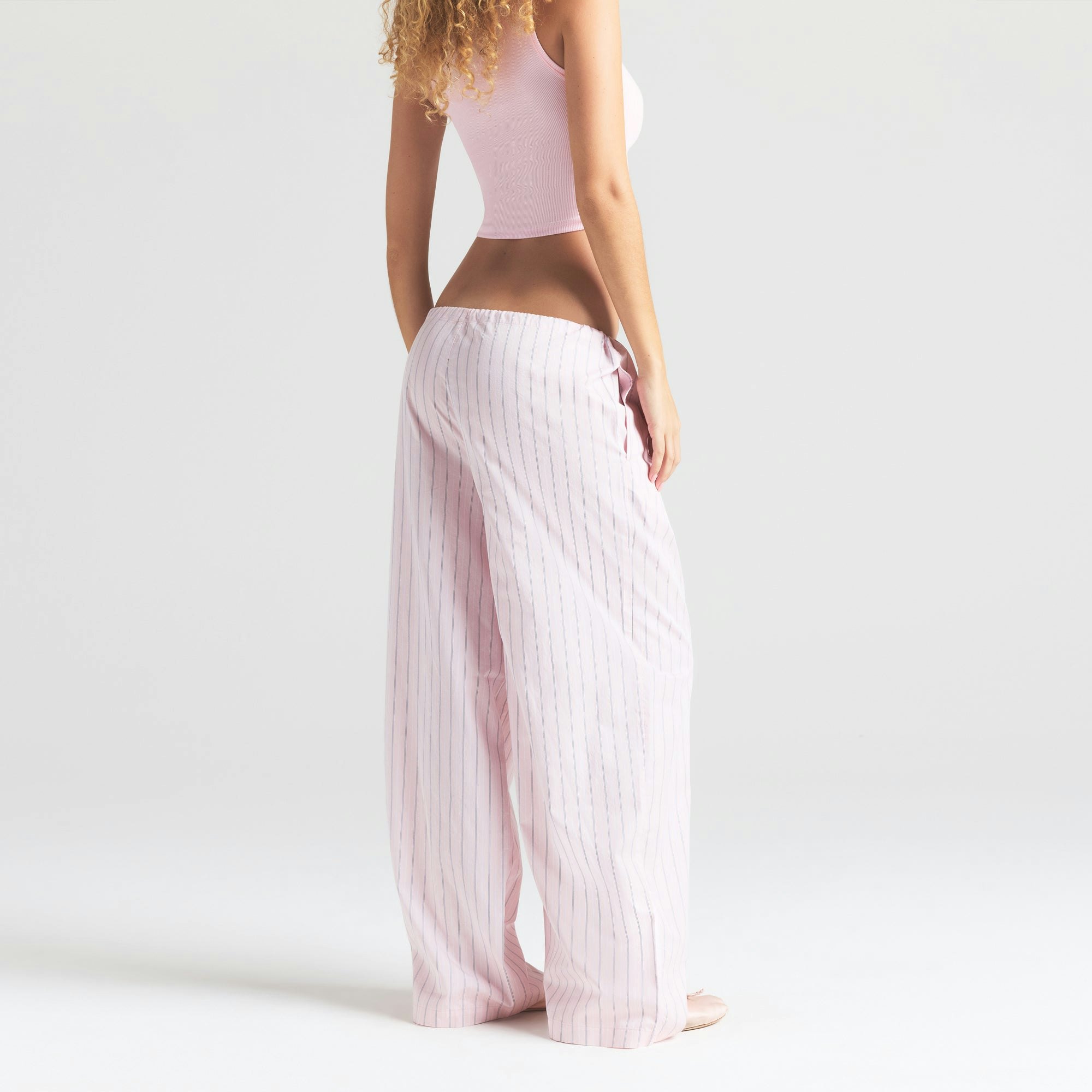 COTTON POPLIN STRAIGHT LEG PANT | PALE PINK AB PENCIL STRIPE ON A MODEL SIDE VIEW | FOCUS: 0.0, 1.0, 0.9