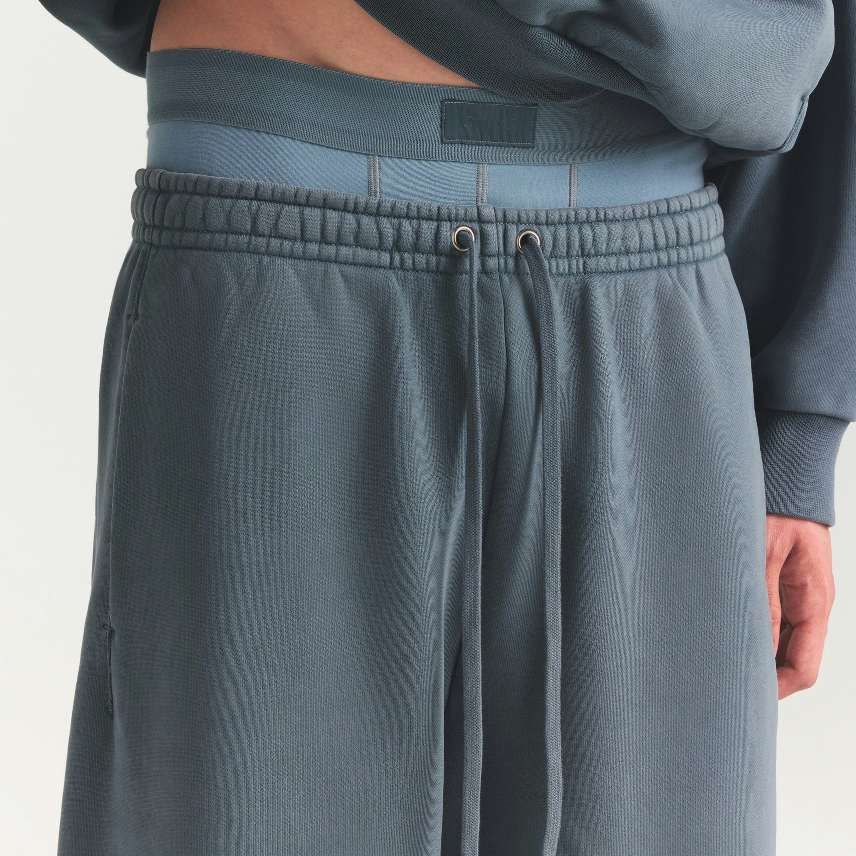 HEAVYWEIGHT FLEECE MENS STRAIGHT LEG PANT | KYANITE ON A MODEL SIDE VIEW @ | FOCUS: 0.0, 1.0, 0.9