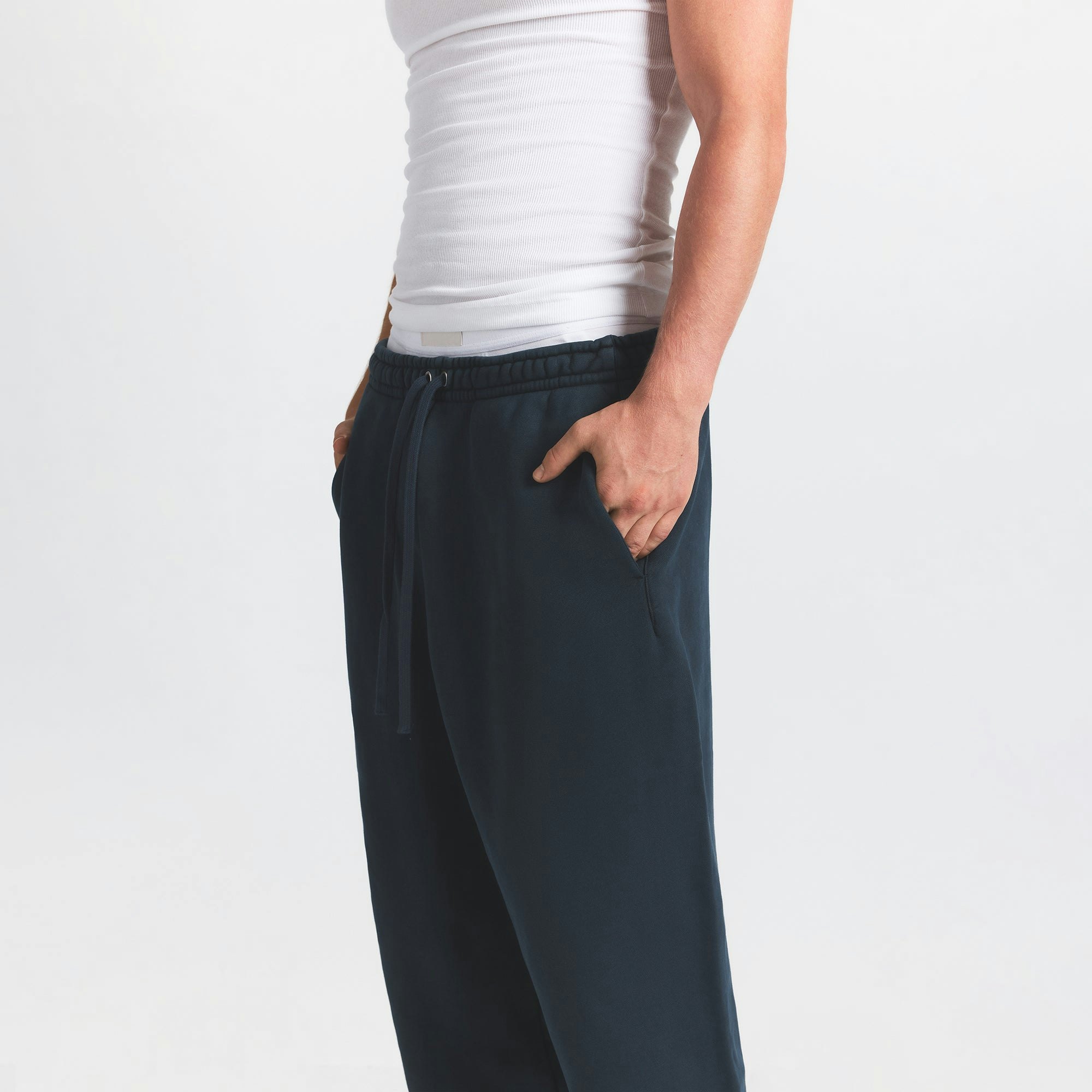 HEAVYWEIGHT FLEECE MENS STRAIGHT LEG PANT | NAVY ON A MODEL SIDE VIEW @ | FOCUS: 0.0, 1.0, 0.9