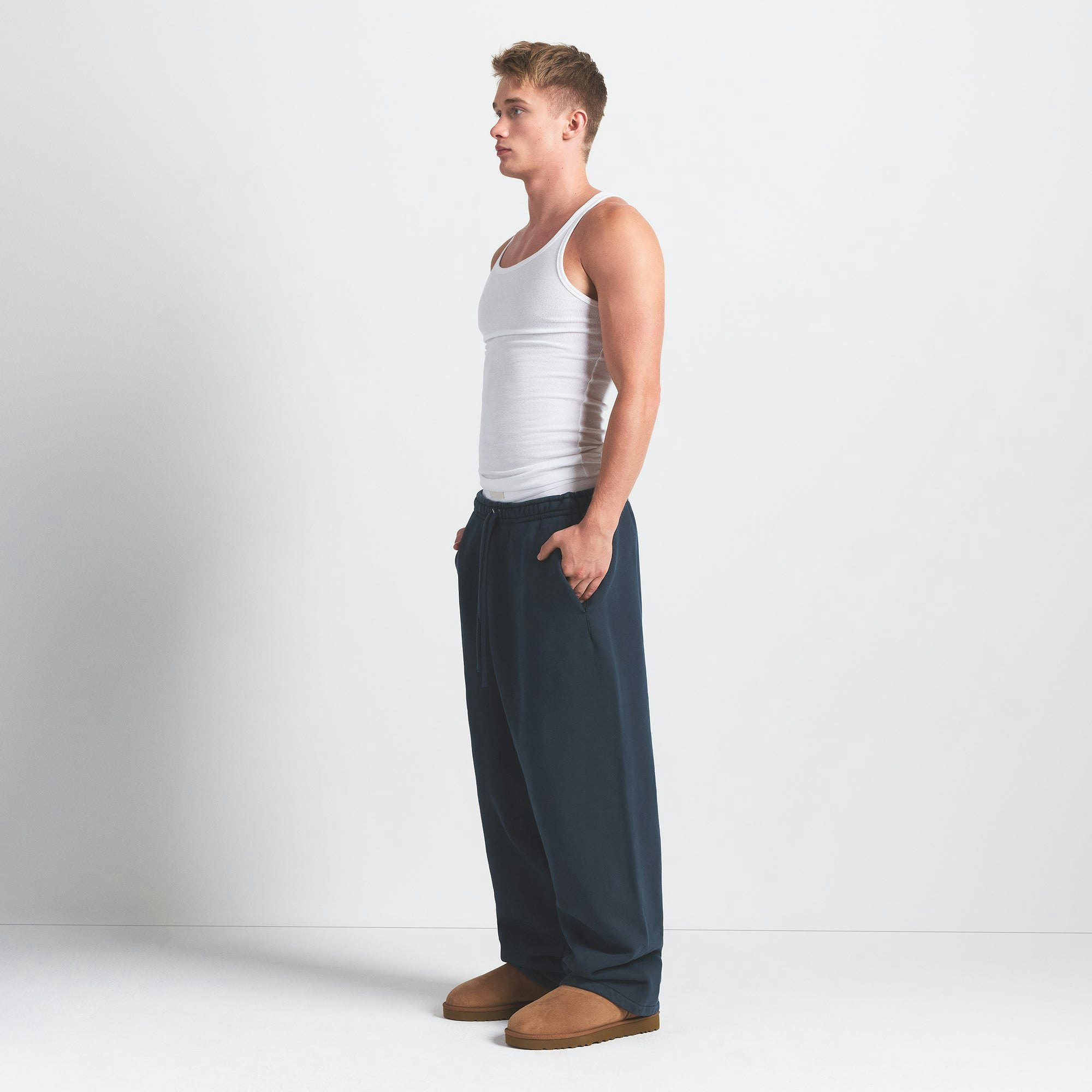 HEAVYWEIGHT FLEECE MENS STRAIGHT LEG PANT | NAVY ON A MODEL SIDE VIEW @ | FOCUS: 0.0, 1.0, 0.9