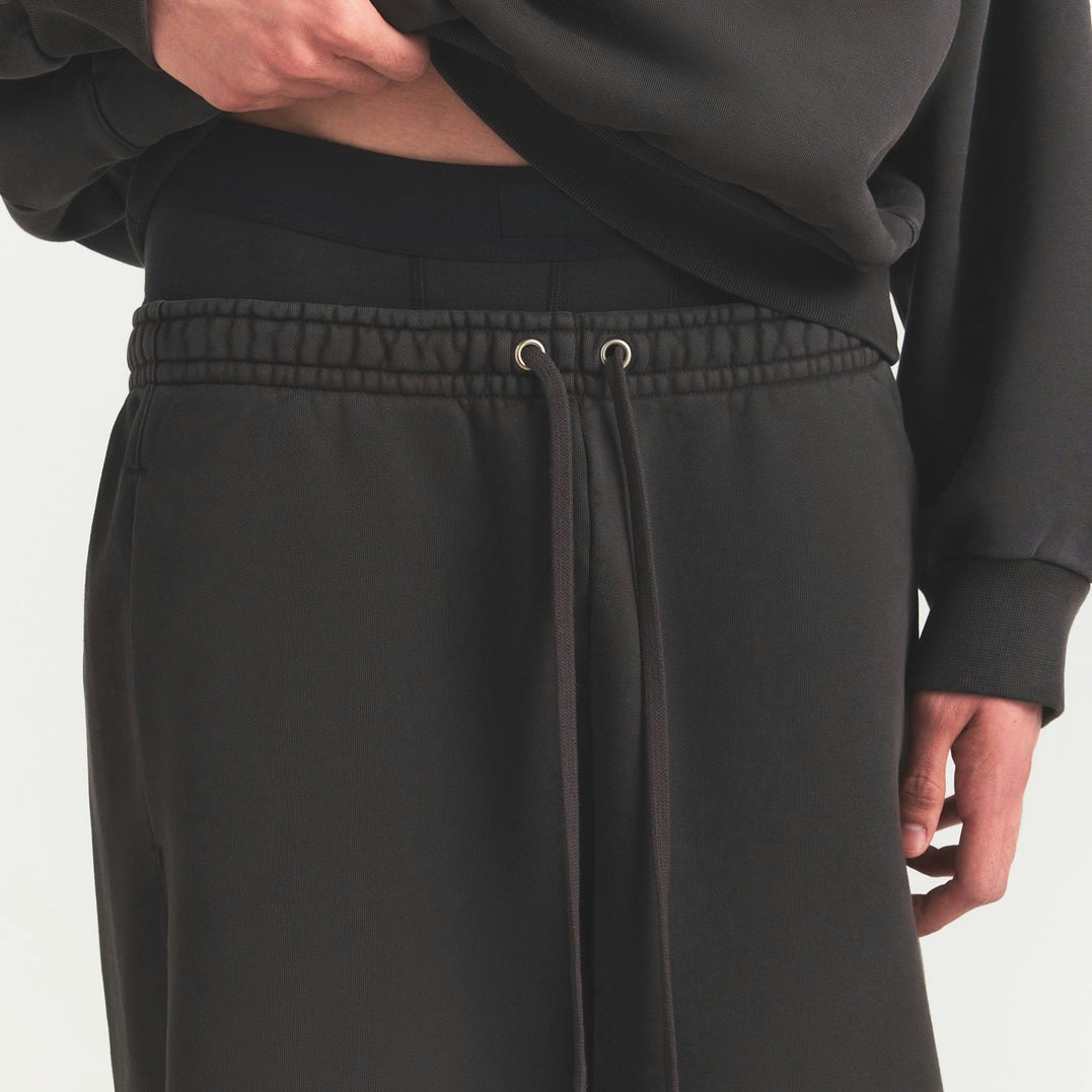 HEAVYWEIGHT FLEECE MENS STRAIGHT LEG PANT | WASHED ONYX ON A MODEL SIDE VIEW @ | FOCUS: 0.0, 1.0, 0.9