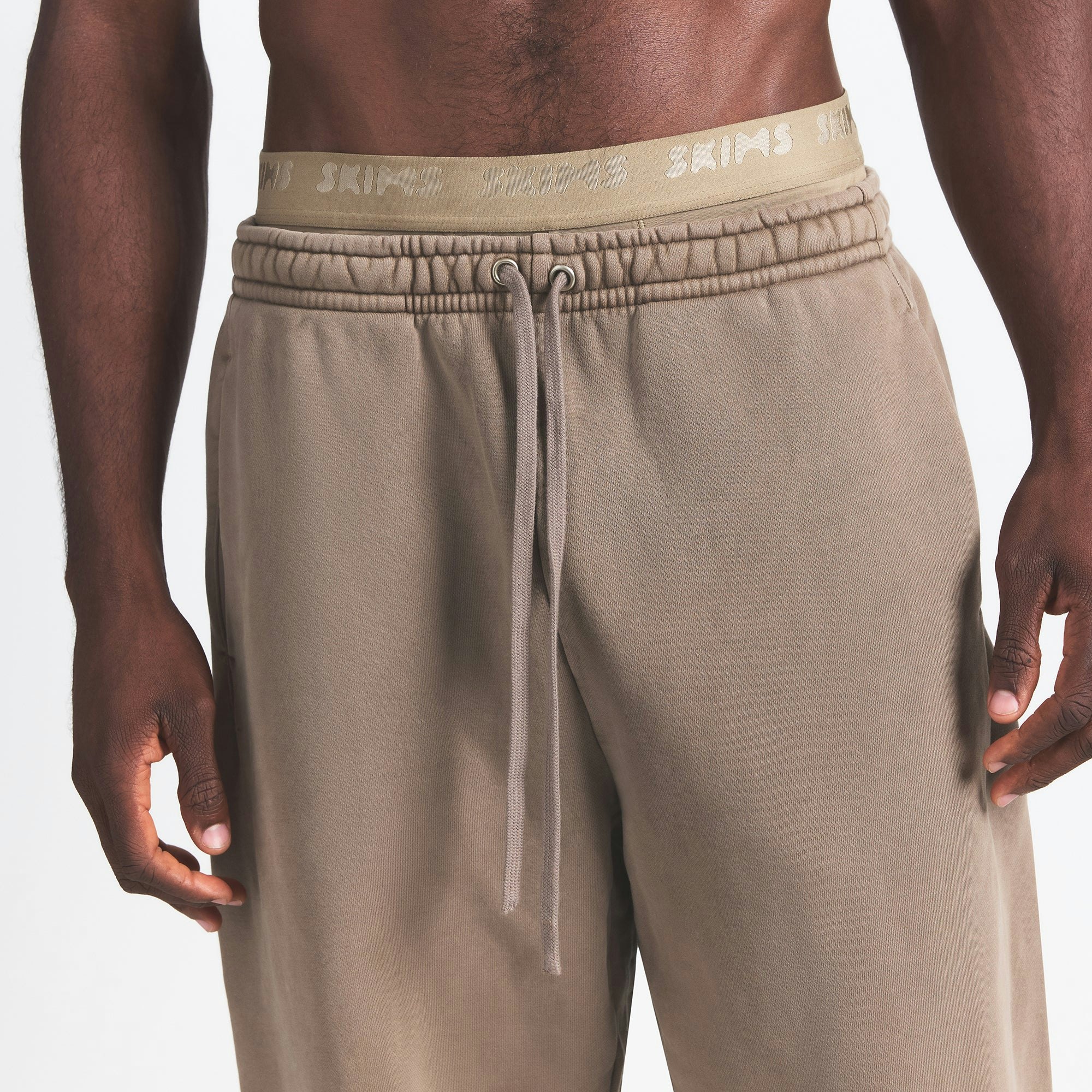 HEAVYWEIGHT FLEECE MENS JOGGER | TRUFFLE ON A MODEL FRONT VIEW @ | FOCUS: 0.0, 1.0, 0.9