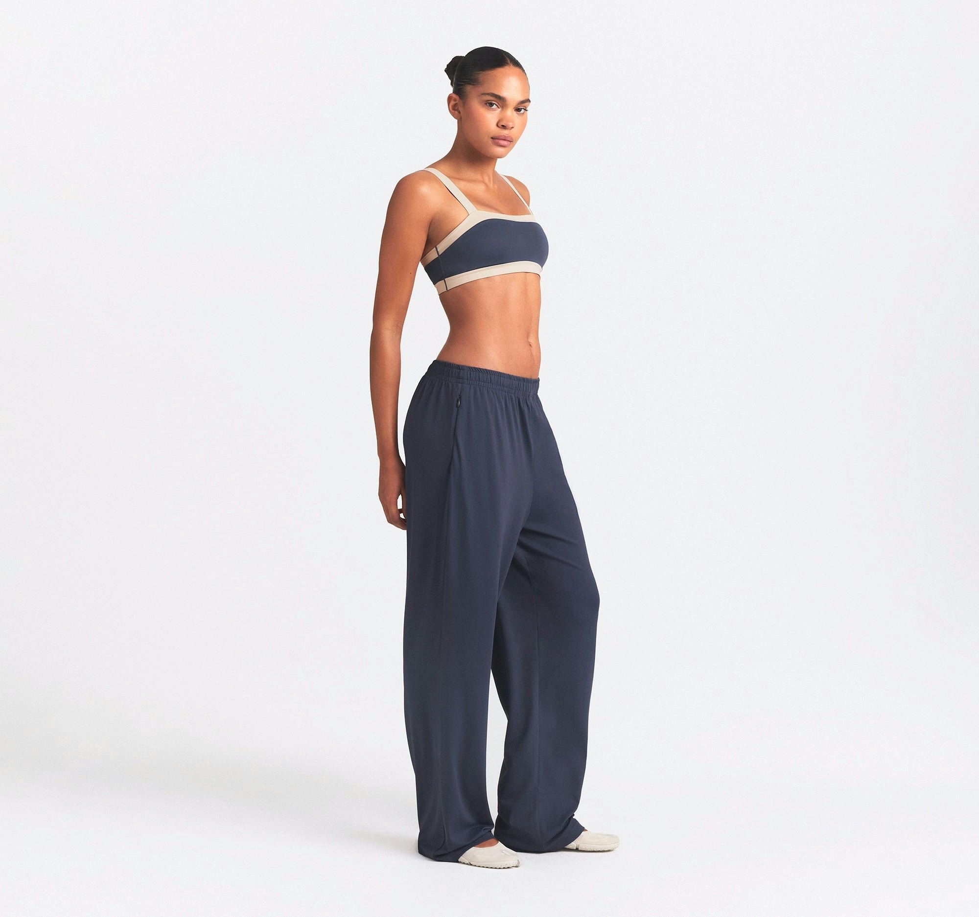 NikeSKIMS AIRY WIDE LEG PANT | DEEP ROYAL ON A MODEL SIDE VIEW @ | FOCUS: 0.0, 1.0, 0.9