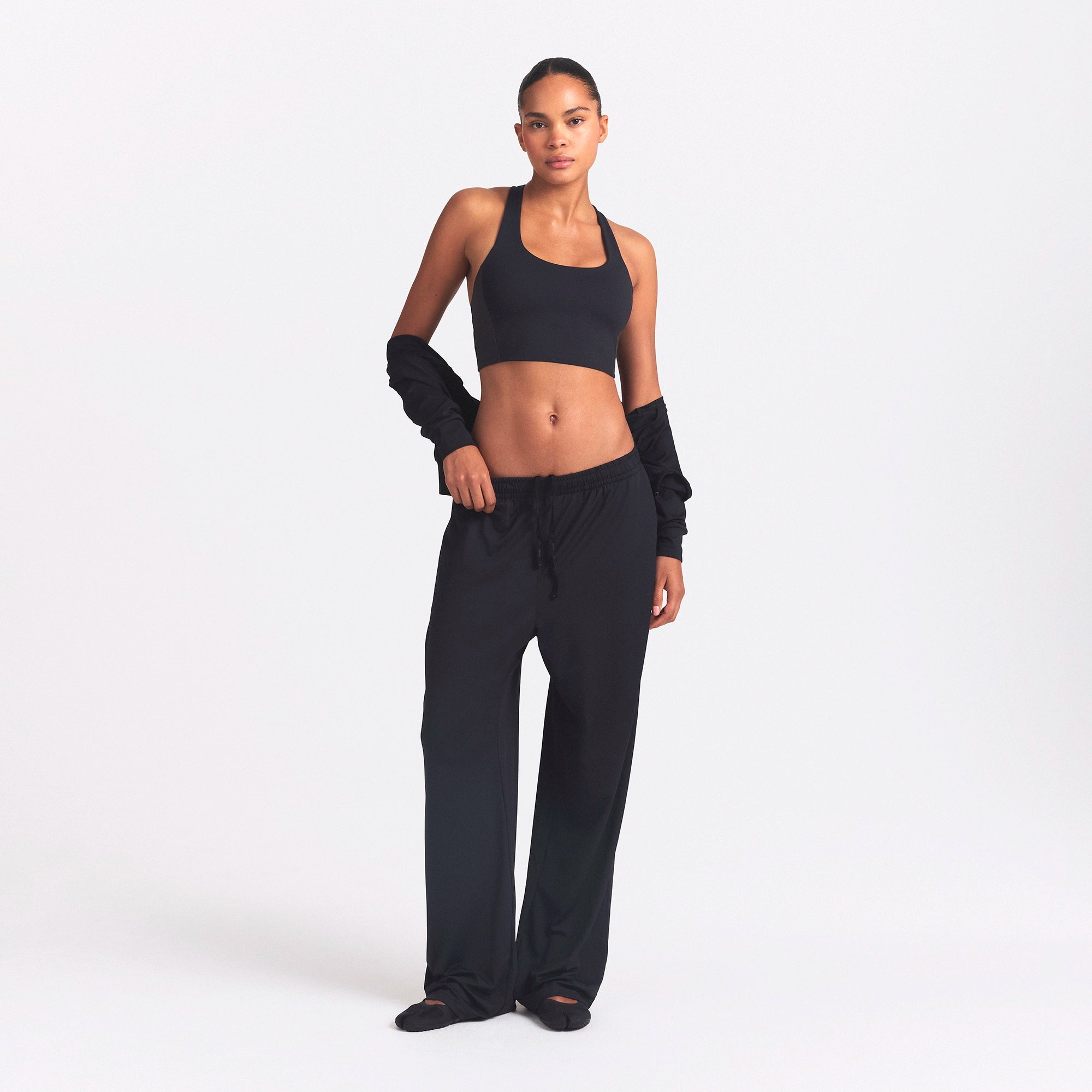 NikeSKIMS AIRY WIDE LEG PANT | OBSIDIAN ON A MODEL FRONT VIEW @ | FOCUS: 0.0, 1.0, 0.9