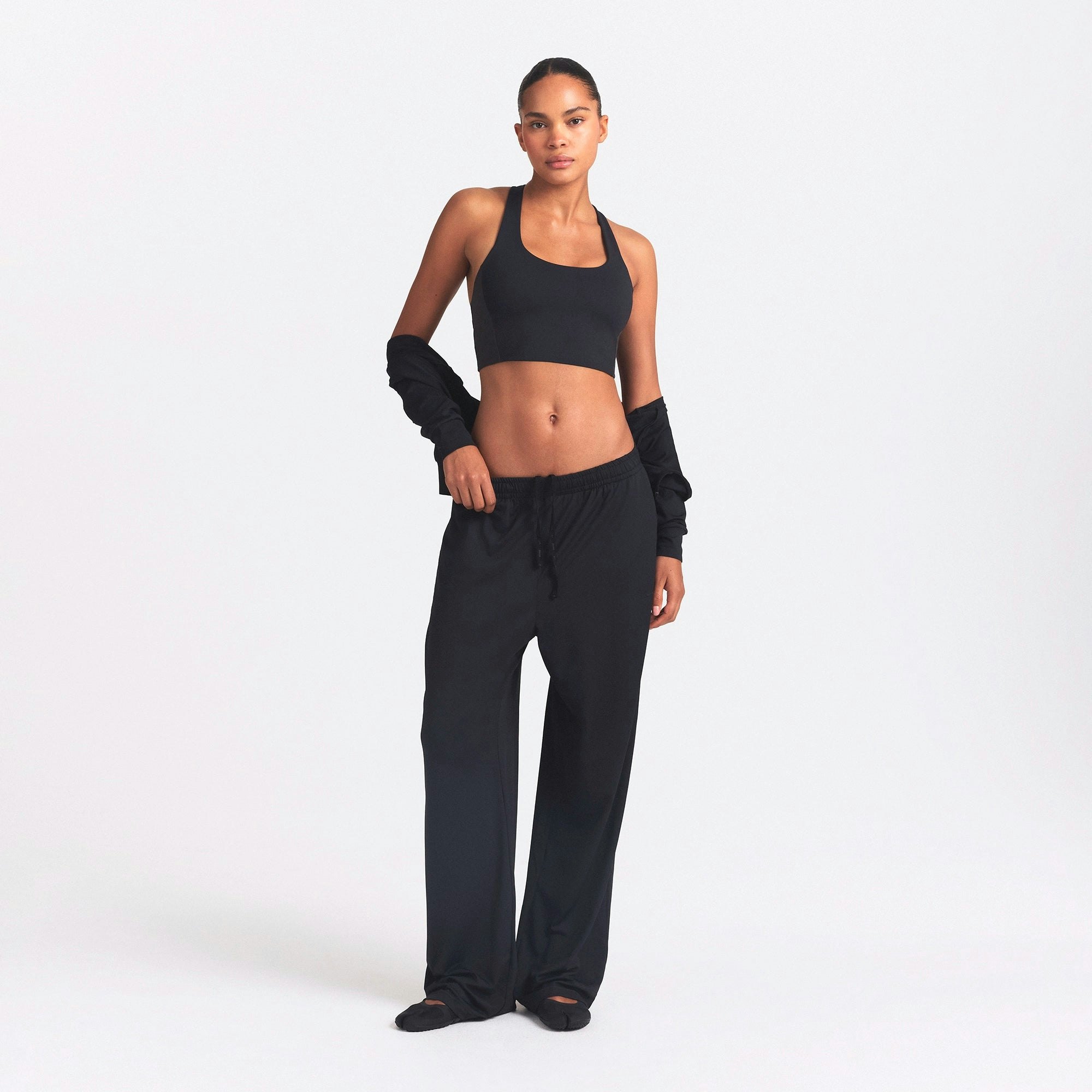 NikeSKIMS AIRY WIDE LEG PANT | OBSIDIAN ON A MODEL FRONT VIEW @ | FOCUS: 0.0, 1.0, 0.9