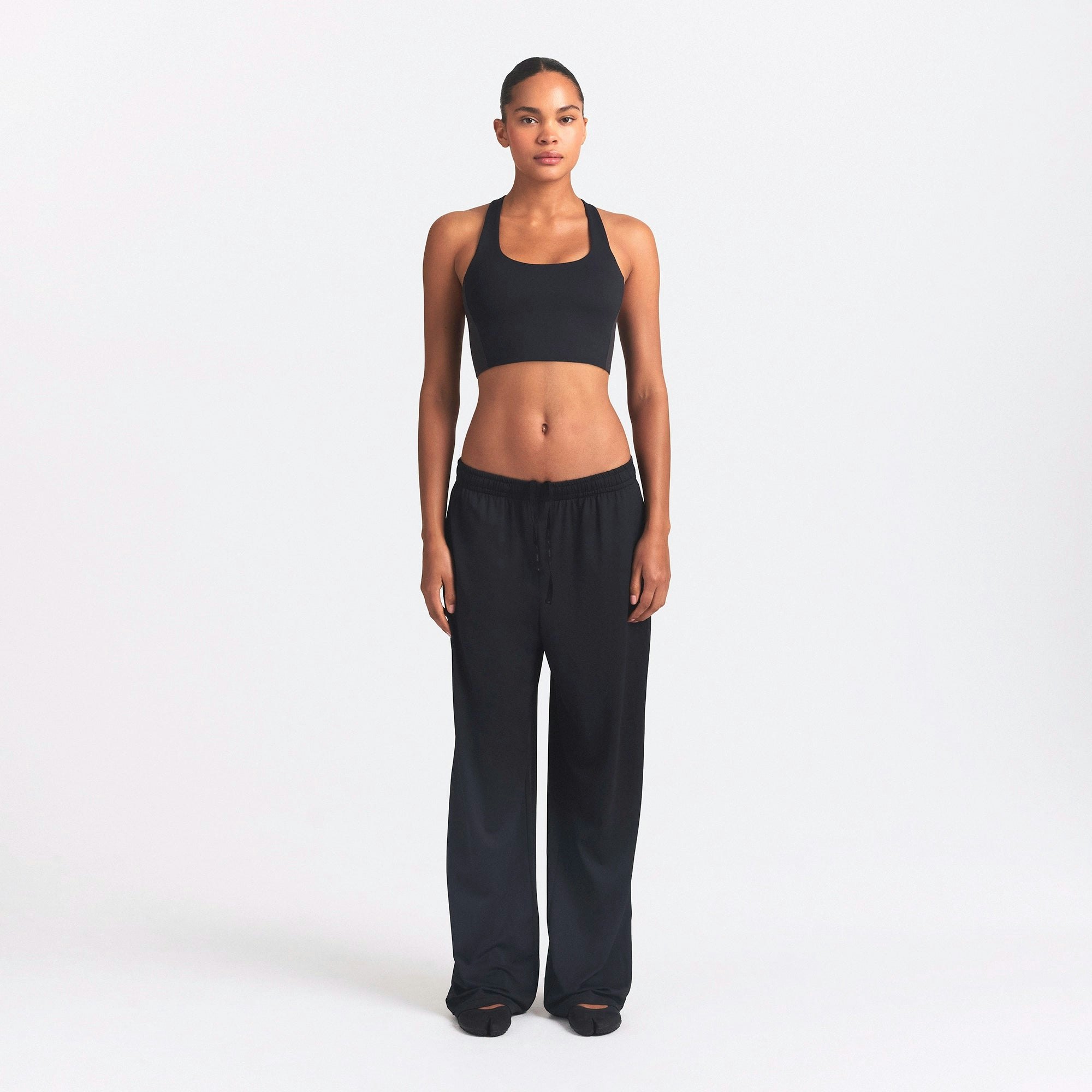 NikeSKIMS AIRY WIDE LEG PANT | OBSIDIAN ON A MODEL FRONT VIEW @ | FOCUS: 0.0, 1.0, 0.9