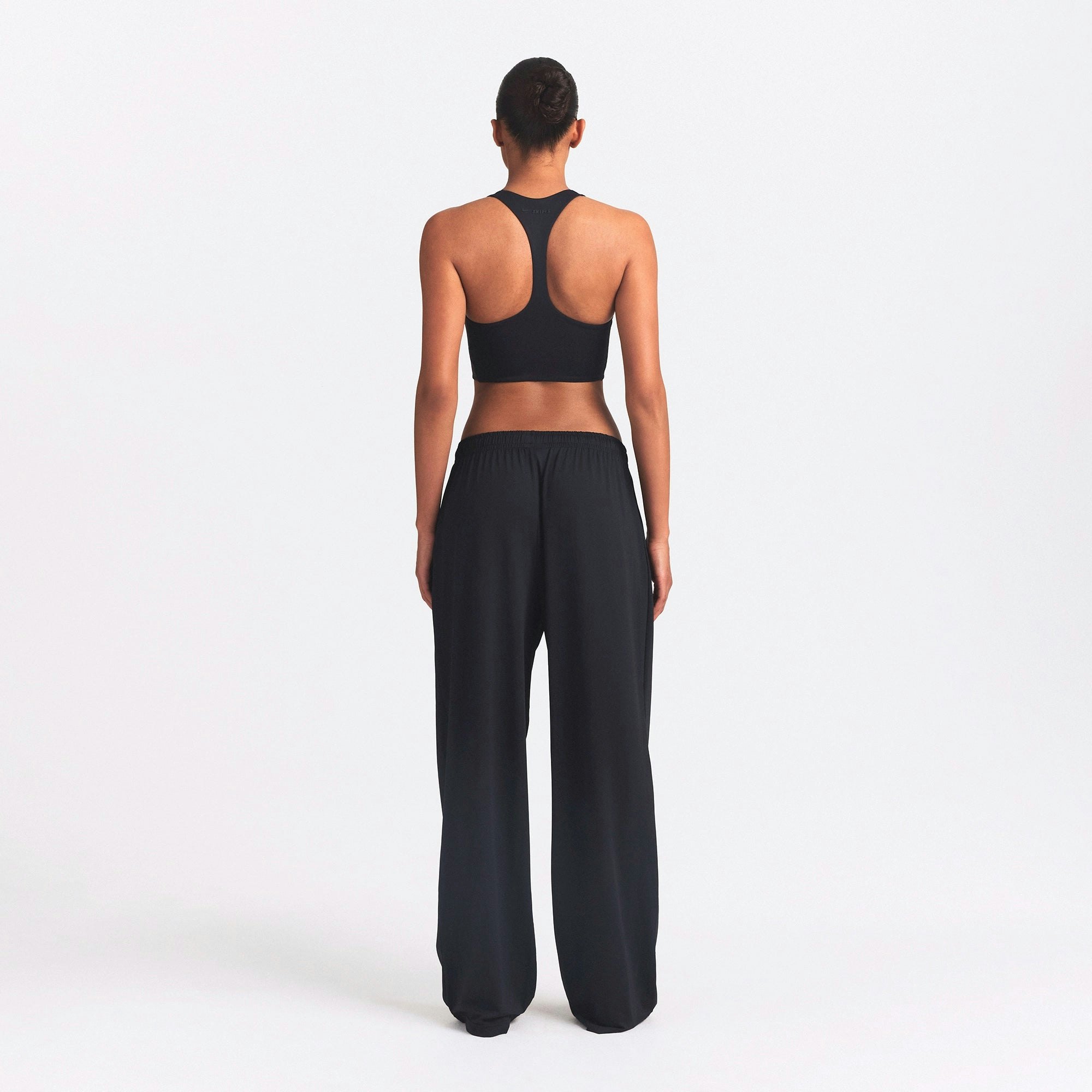 NikeSKIMS AIRY WIDE LEG PANT | OBSIDIAN ON A MODEL SIDE VIEW @ | FOCUS: 0.0, 1.0, 0.9