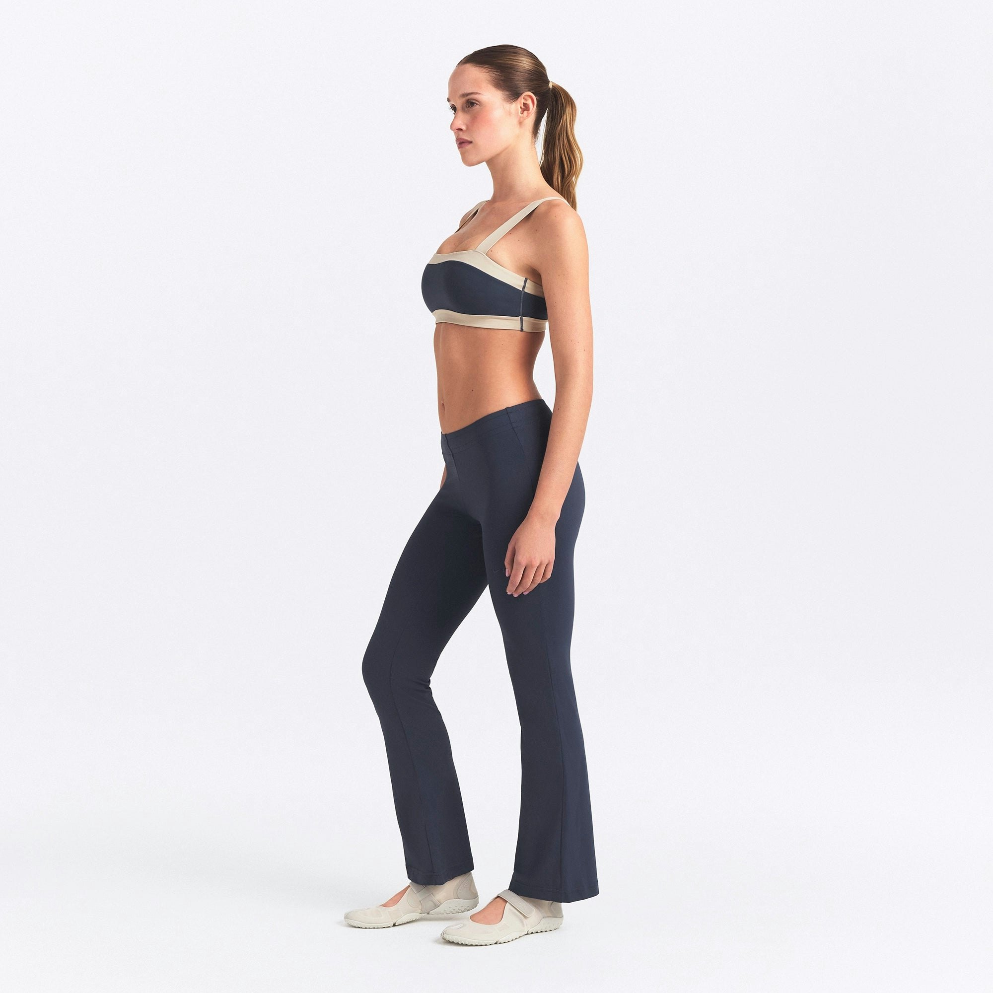 NikeSKIMS AIRY STRAIGHT LEG PANT | DEEP ROYAL ON A MODEL SIDE VIEW @ | FOCUS: 0.0, 1.0, 0.9