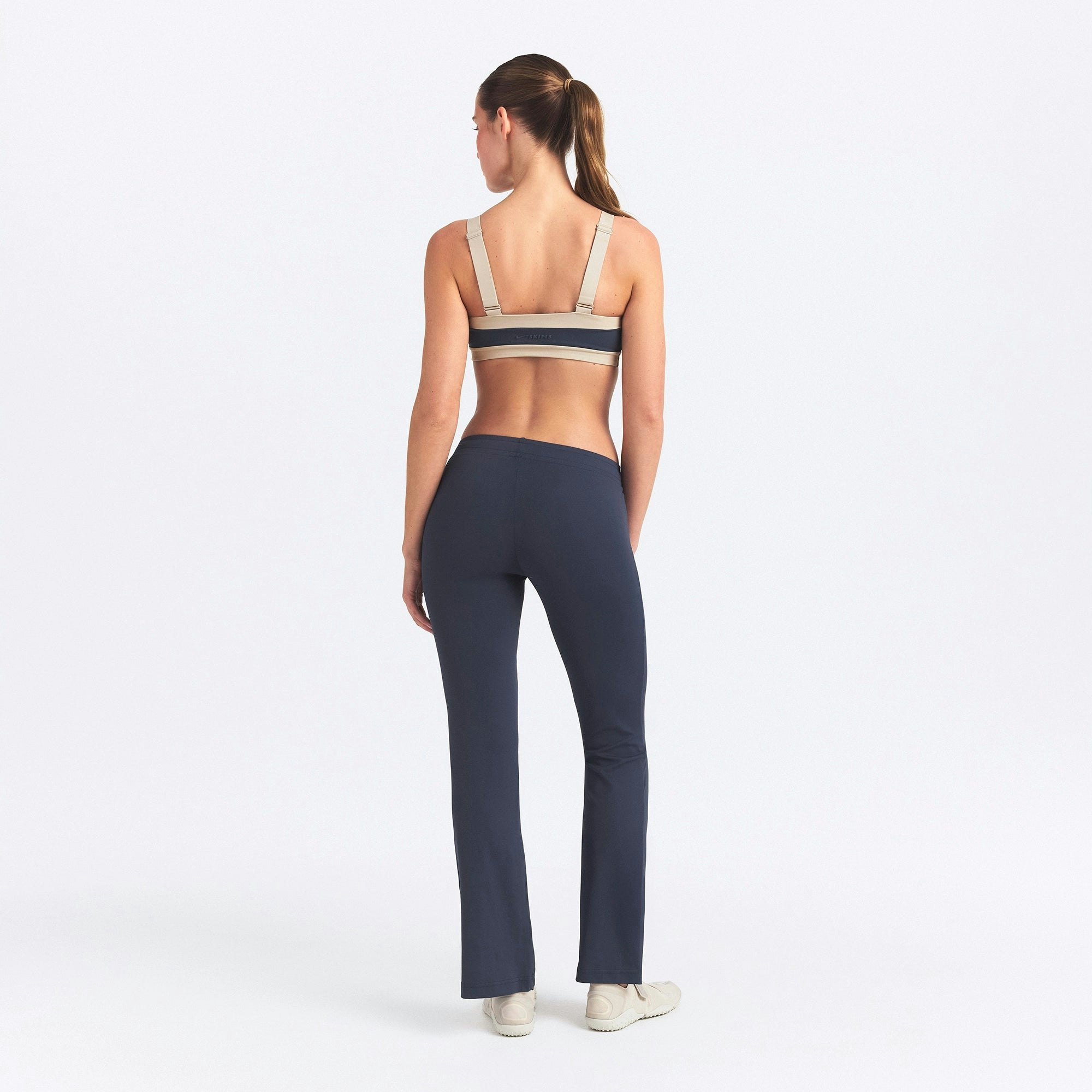 NikeSKIMS AIRY STRAIGHT LEG PANT | DEEP ROYAL ON A MODEL SIDE VIEW @ | FOCUS: 0.0, 1.0, 0.9