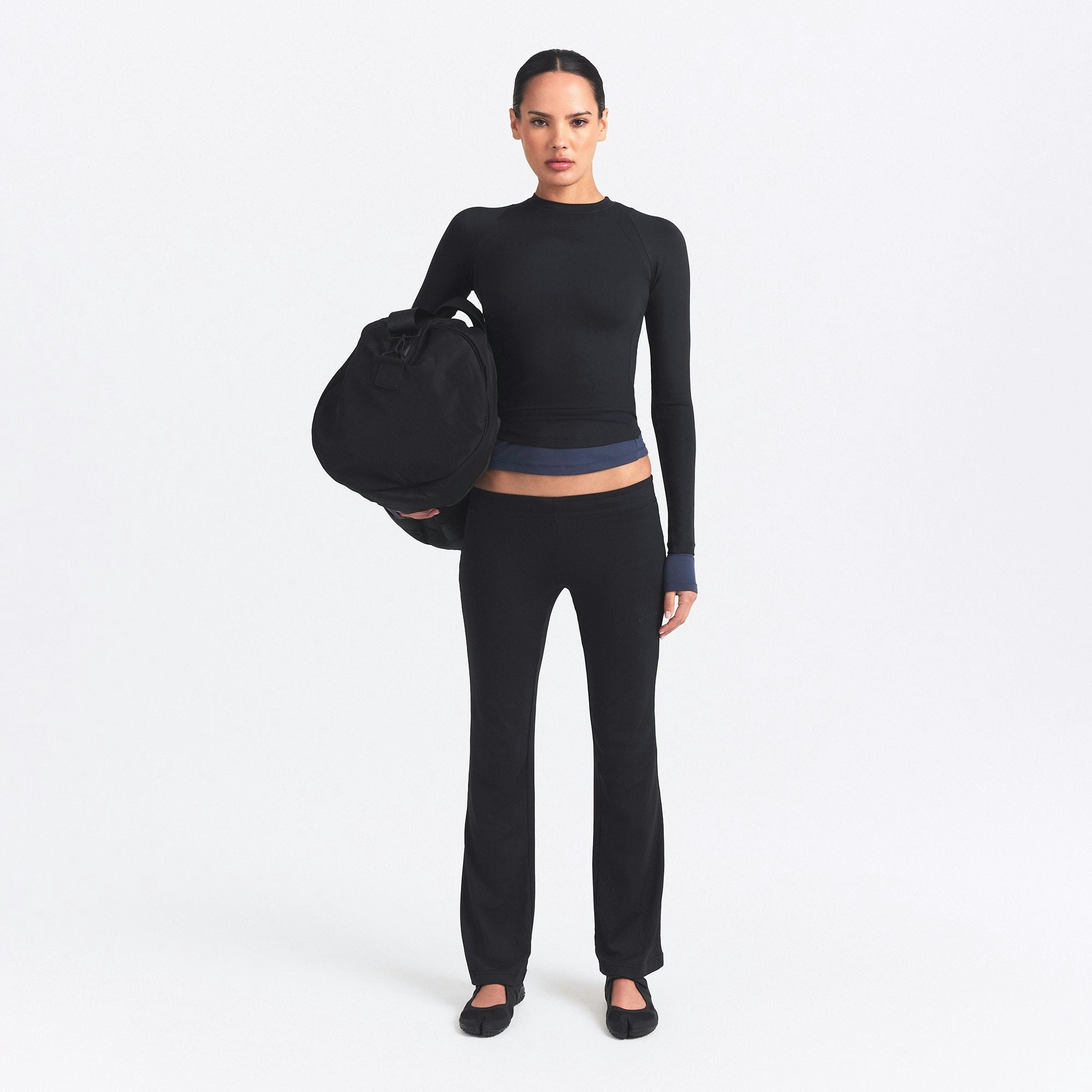 NikeSKIMS AIRY STRAIGHT LEG PANT | OBSIDIAN ON A MODEL FRONT VIEW @ | FOCUS: 0.0, 1.0, 0.9