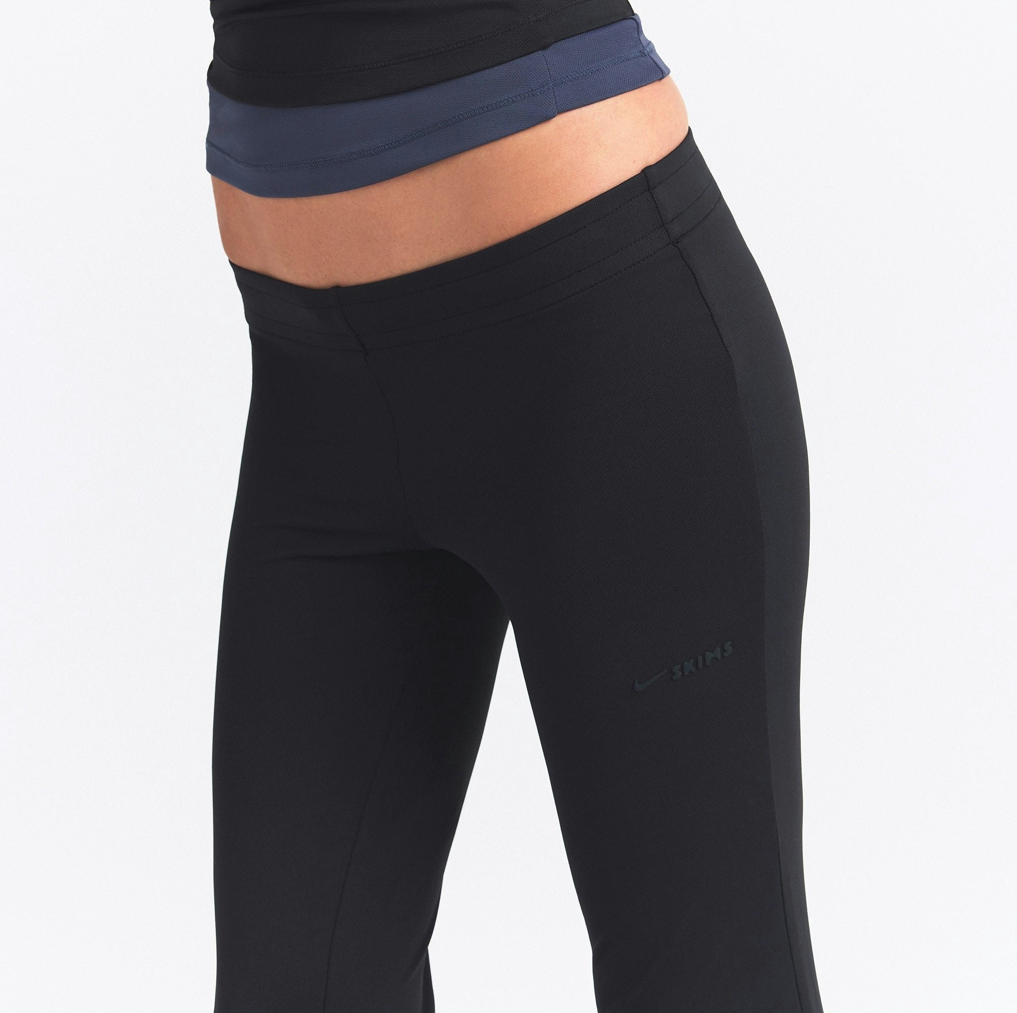 NikeSKIMS AIRY STRAIGHT LEG PANT | OBSIDIAN ON A MODEL SIDE VIEW @ | FOCUS: 0.0, 1.0, 0.9