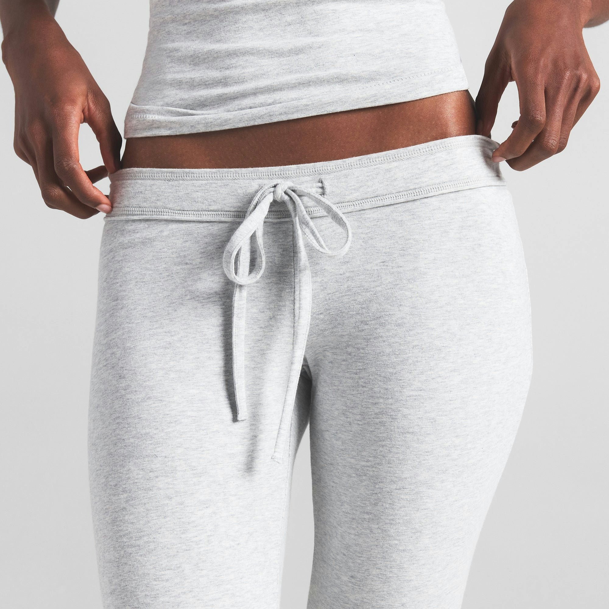 COTTON JERSEY LOW RISE CROP PANT | LIGHT HEATHER GREY ON A MODEL FRONT VIEW | FOCUS: 0.0, 1.0, 0.9