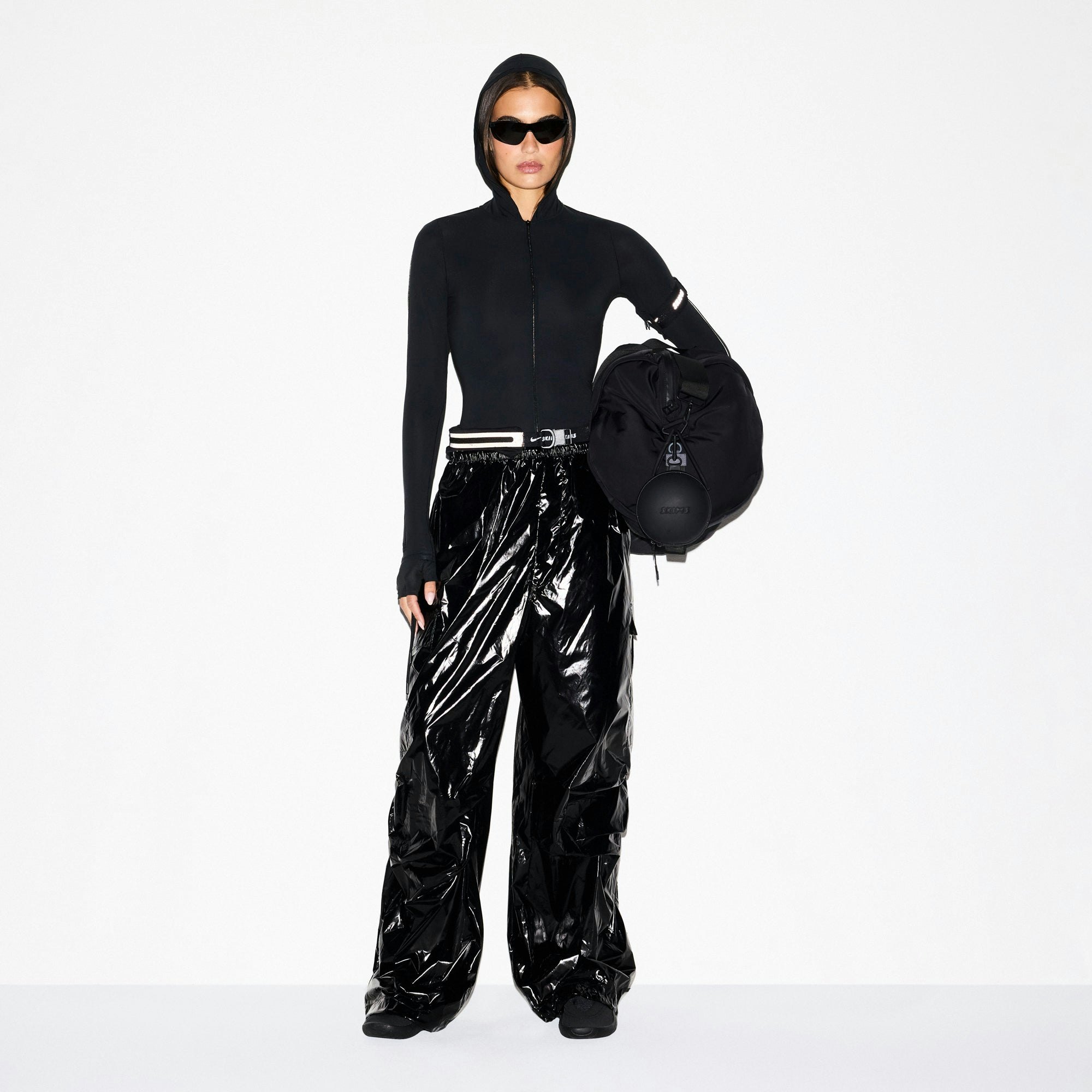 NikeSKIMS SHINY NYLON CARGO PANT | OBSIDIAN ON A MODEL FRONT VIEW @ | FOCUS: 0.0, 1.0, 0.9