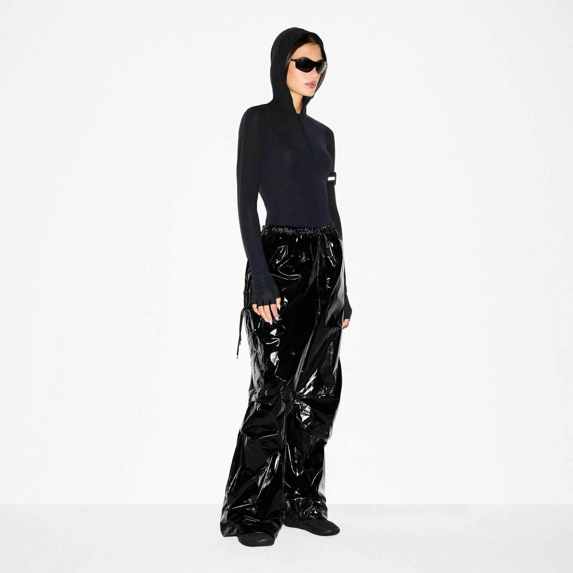 NikeSKIMS SHINY NYLON CARGO PANT | OBSIDIAN ON A MODEL SIDE VIEW @ | FOCUS: 0.0, 1.0, 0.9