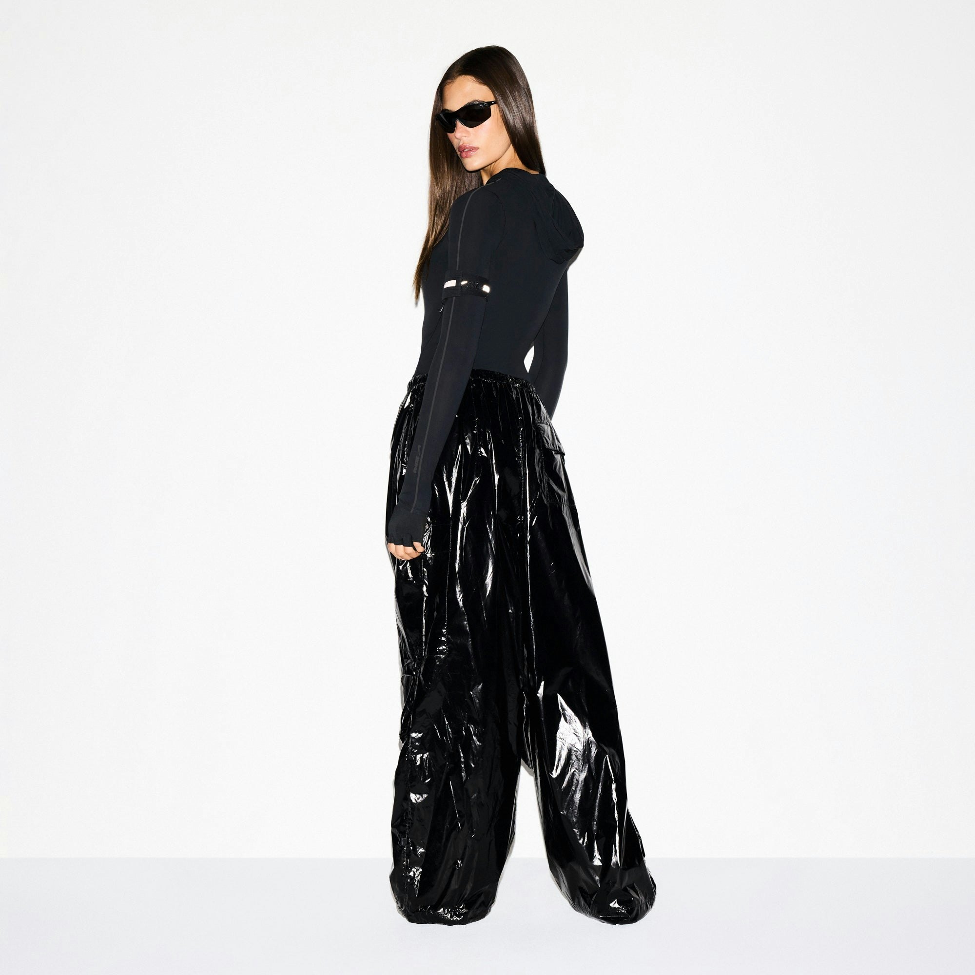 NikeSKIMS SHINY NYLON CARGO PANT | OBSIDIAN ON A MODEL SIDE VIEW @ | FOCUS: 0.0, 1.0, 0.9
