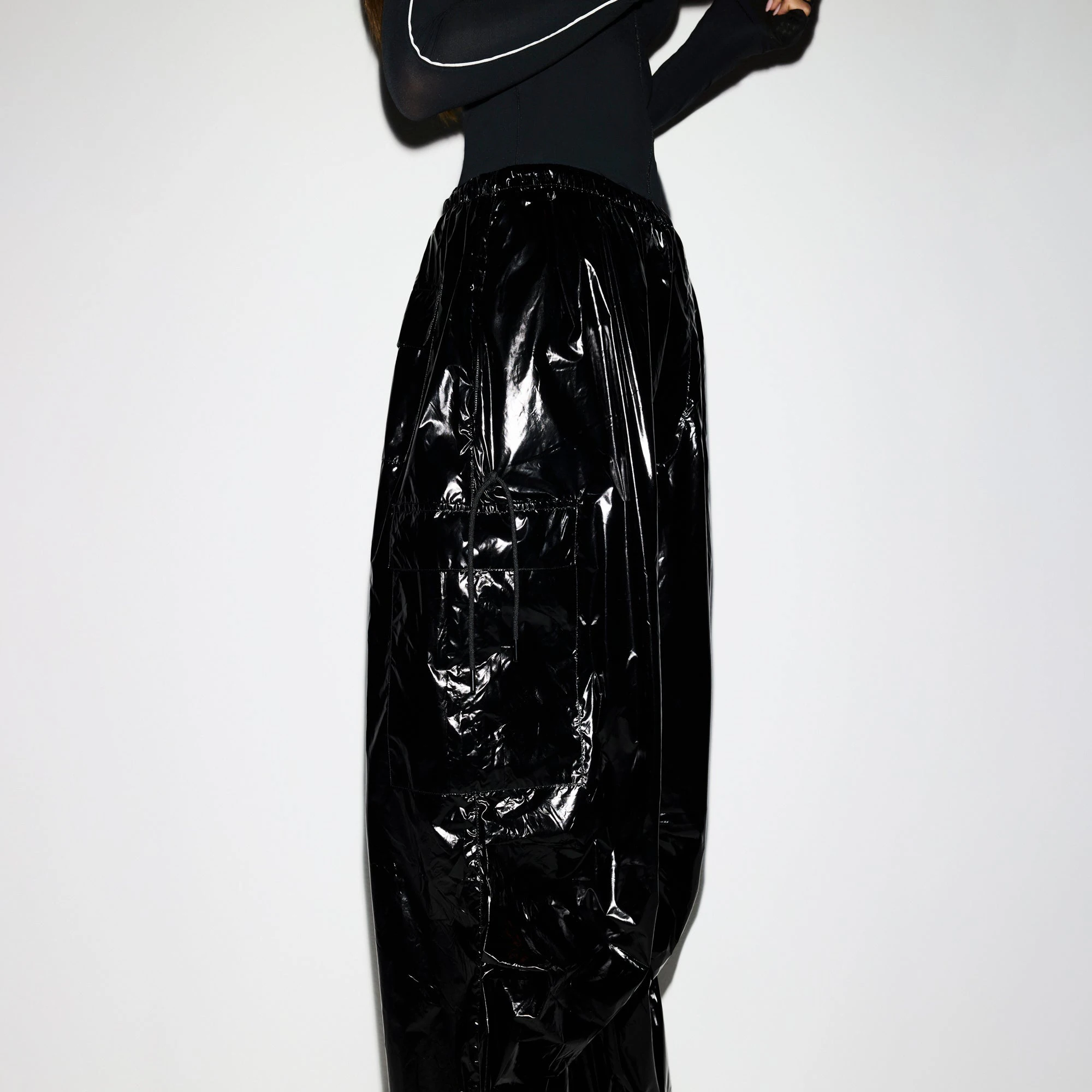 NikeSKIMS SHINY NYLON CARGO PANT | OBSIDIAN ON A MODEL SIDE VIEW @ | FOCUS: 0.0, 1.0, 0.9