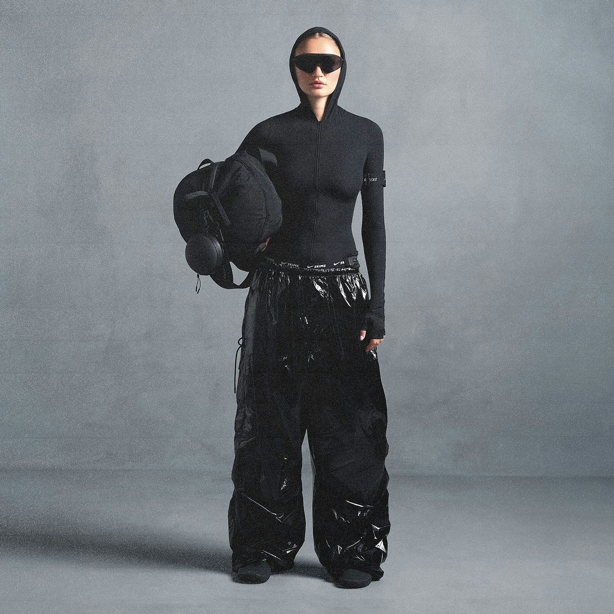 NikeSKIMS SHINY NYLON CARGO PANT | OBSIDIAN ON A MODEL FRONT VIEW @ | FOCUS: 0.0, 1.0, 0.9