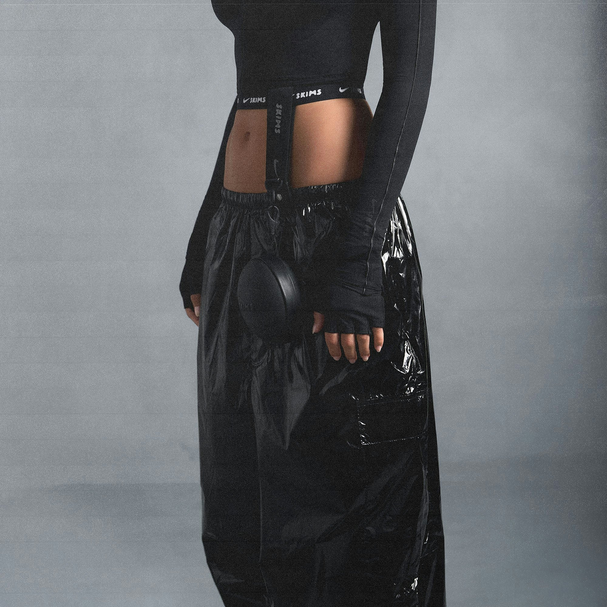 NikeSKIMS SHINY NYLON CARGO PANT | OBSIDIAN ON A MODEL SIDE VIEW @ | FOCUS: 0.0, 1.0, 0.9
