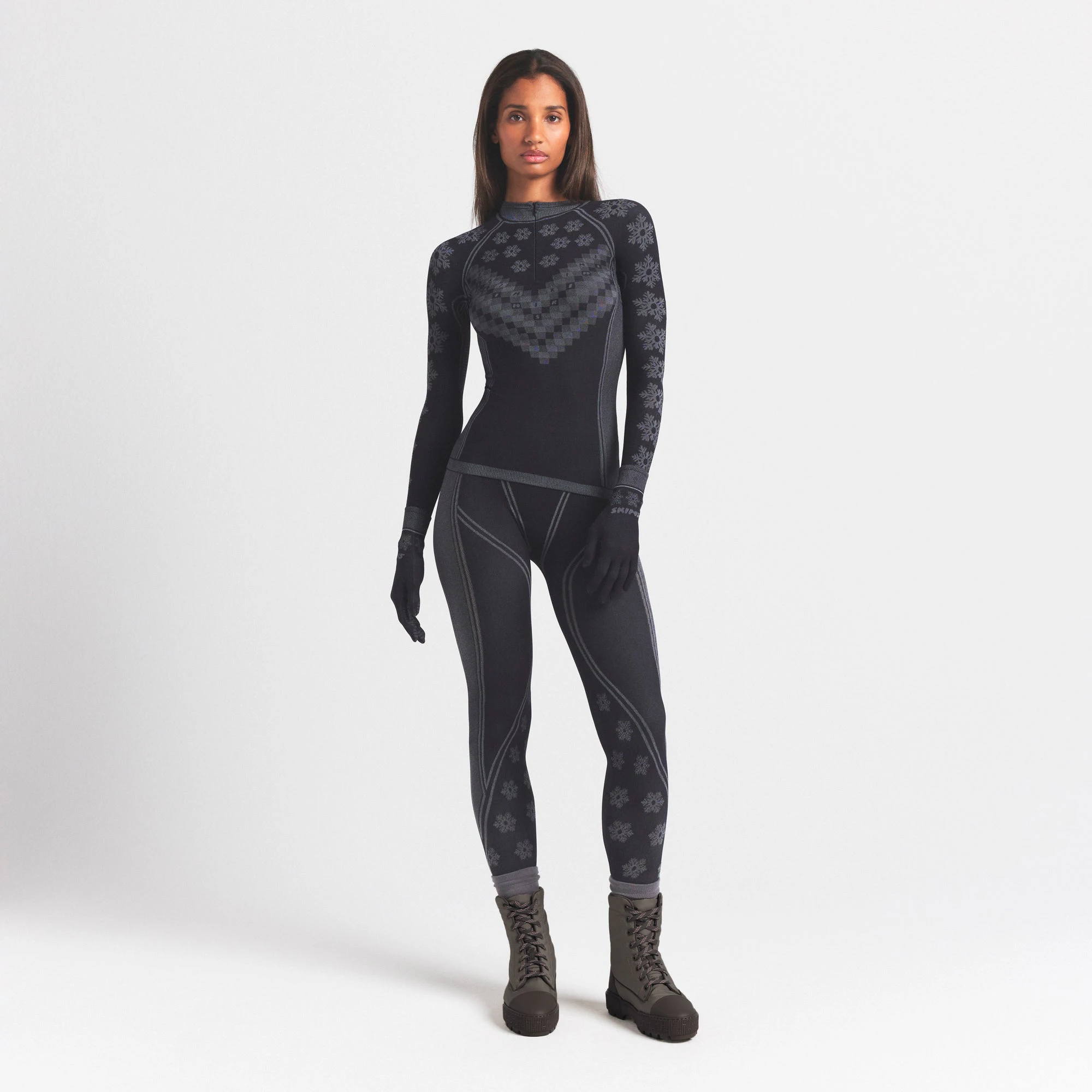 SKIMS FIRST LAYERS LEGGING | OBSIDIAN WINTER FAIR ISLE ON A MODEL FRONT VIEW @ | FOCUS: 0.0, 1.0, 0.9