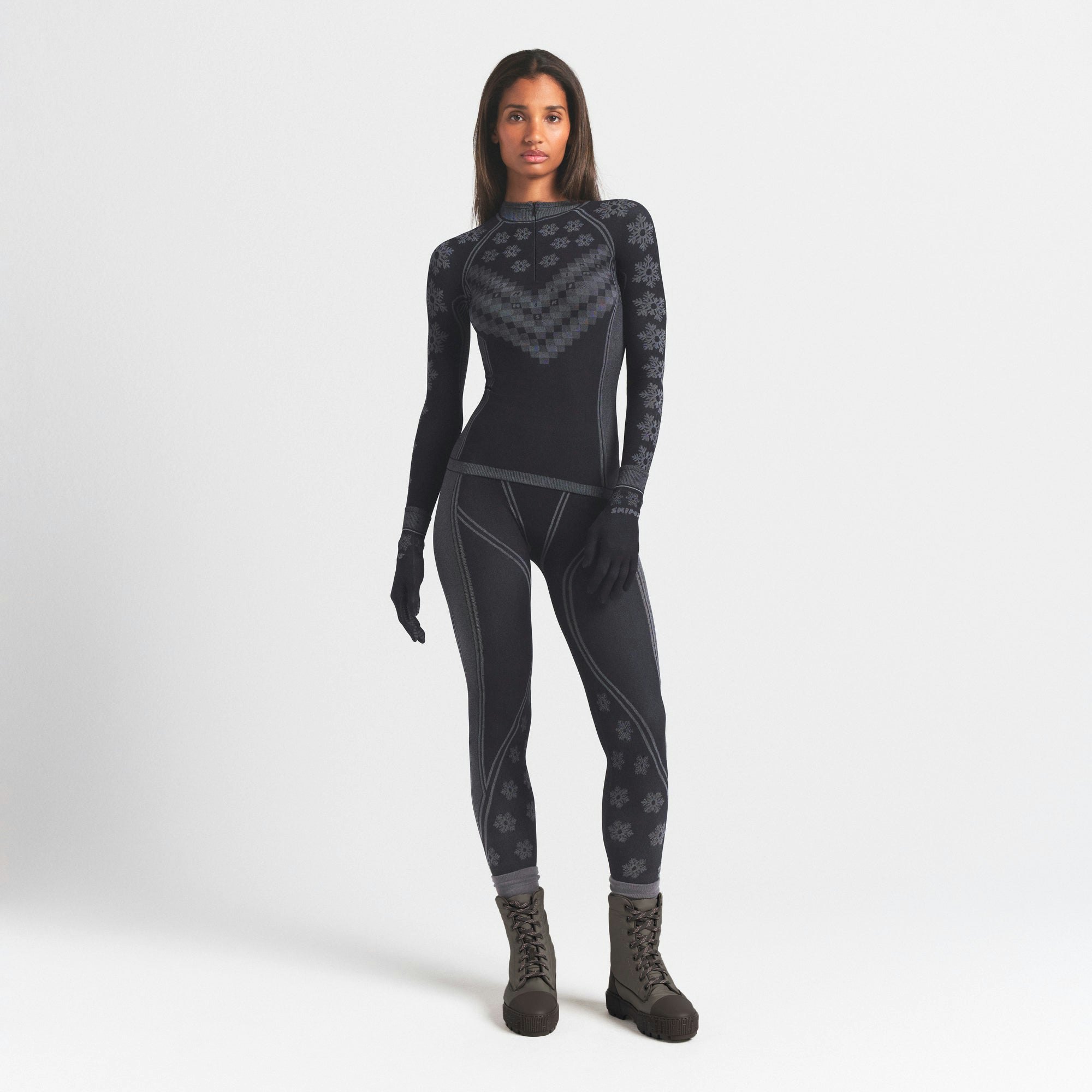 SKIMS FIRST LAYERS LEGGING | OBSIDIAN WINTER FAIR ISLE ON A MODEL FRONT VIEW @ | FOCUS: 0.0, 1.0, 0.9