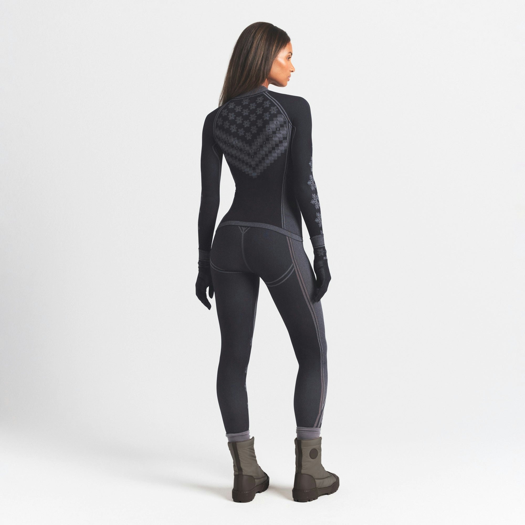 SKIMS FIRST LAYERS LEGGING | OBSIDIAN WINTER FAIR ISLE ON A MODEL SIDE VIEW @ | FOCUS: 0.0, 1.0, 0.9