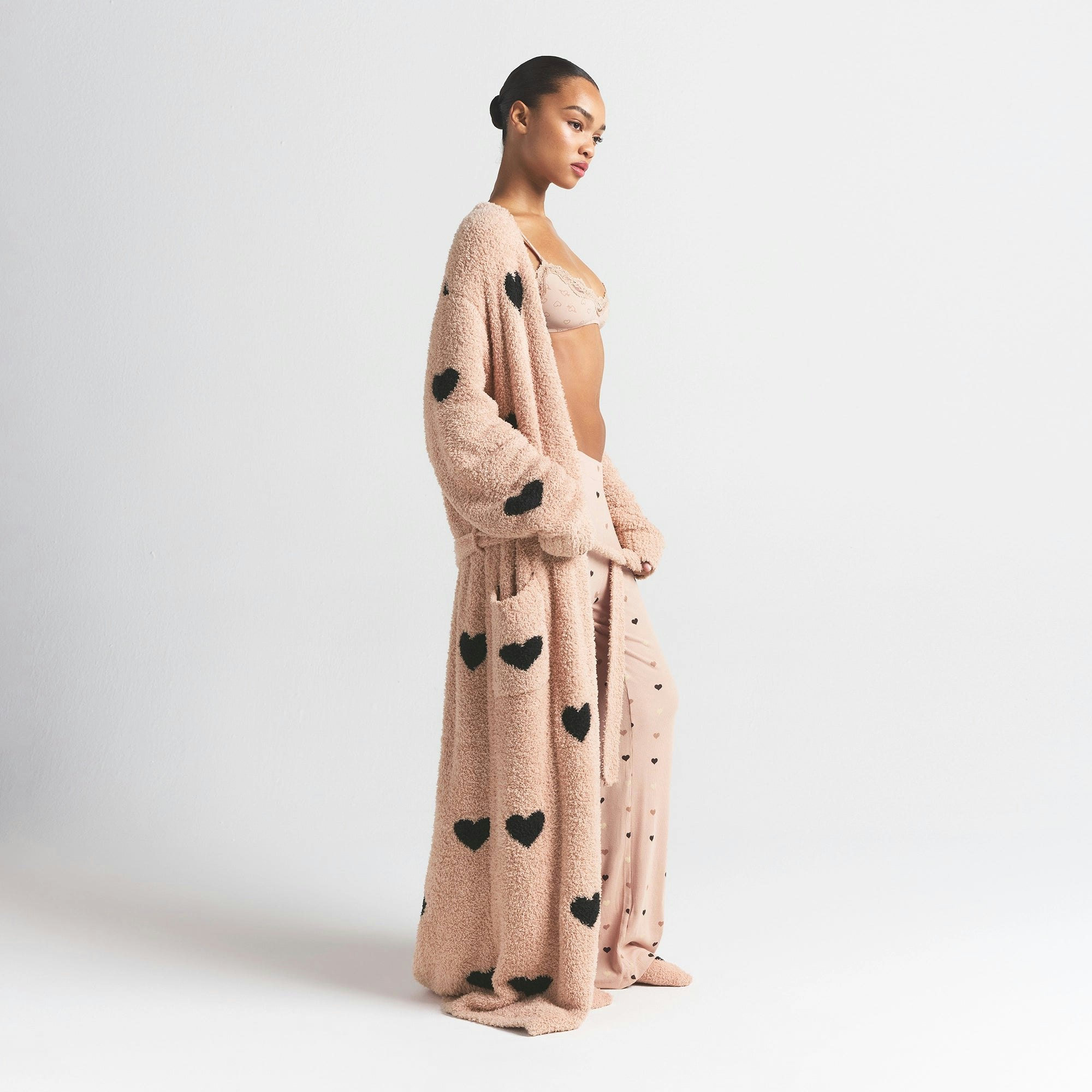 COZY KNIT UNISEX ROBE | MICA SPACED HEARTS ON A MODEL SIDE VIEW @ | FOCUS: 0.0, 1.0, 0.9