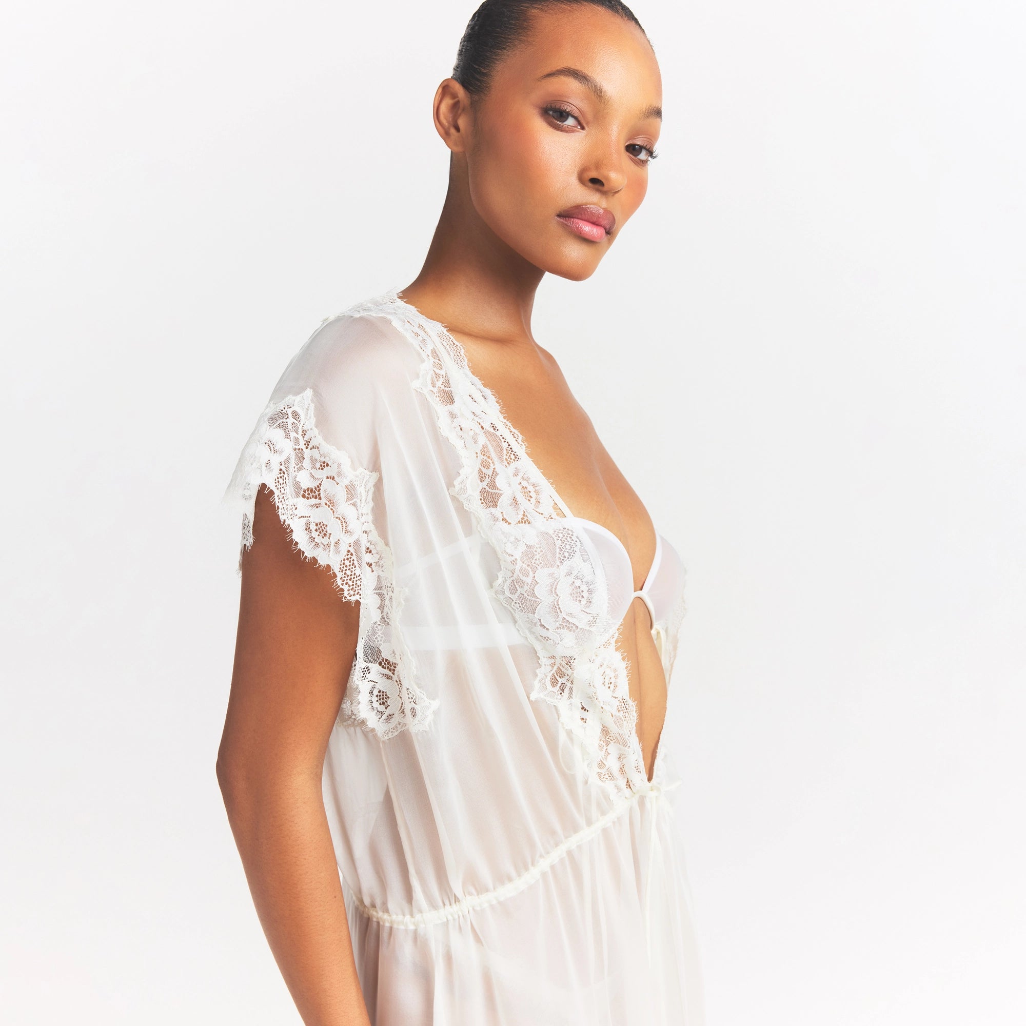 SKIMS ROMANCE LONG ROBE | IVORY ON A MODEL SIDE VIEW @ | FOCUS: 0.0, 1.0, 0.9
