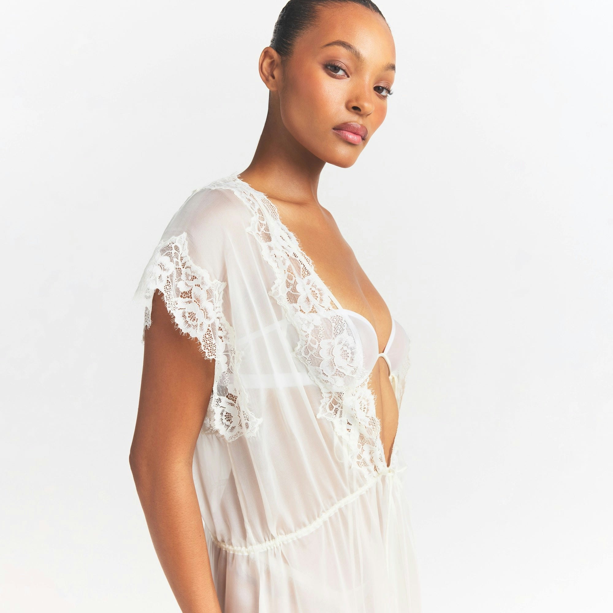 SKIMS ROMANCE LONG ROBE | IVORY ON A MODEL SIDE VIEW @ | FOCUS: 0.0, 1.0, 0.9