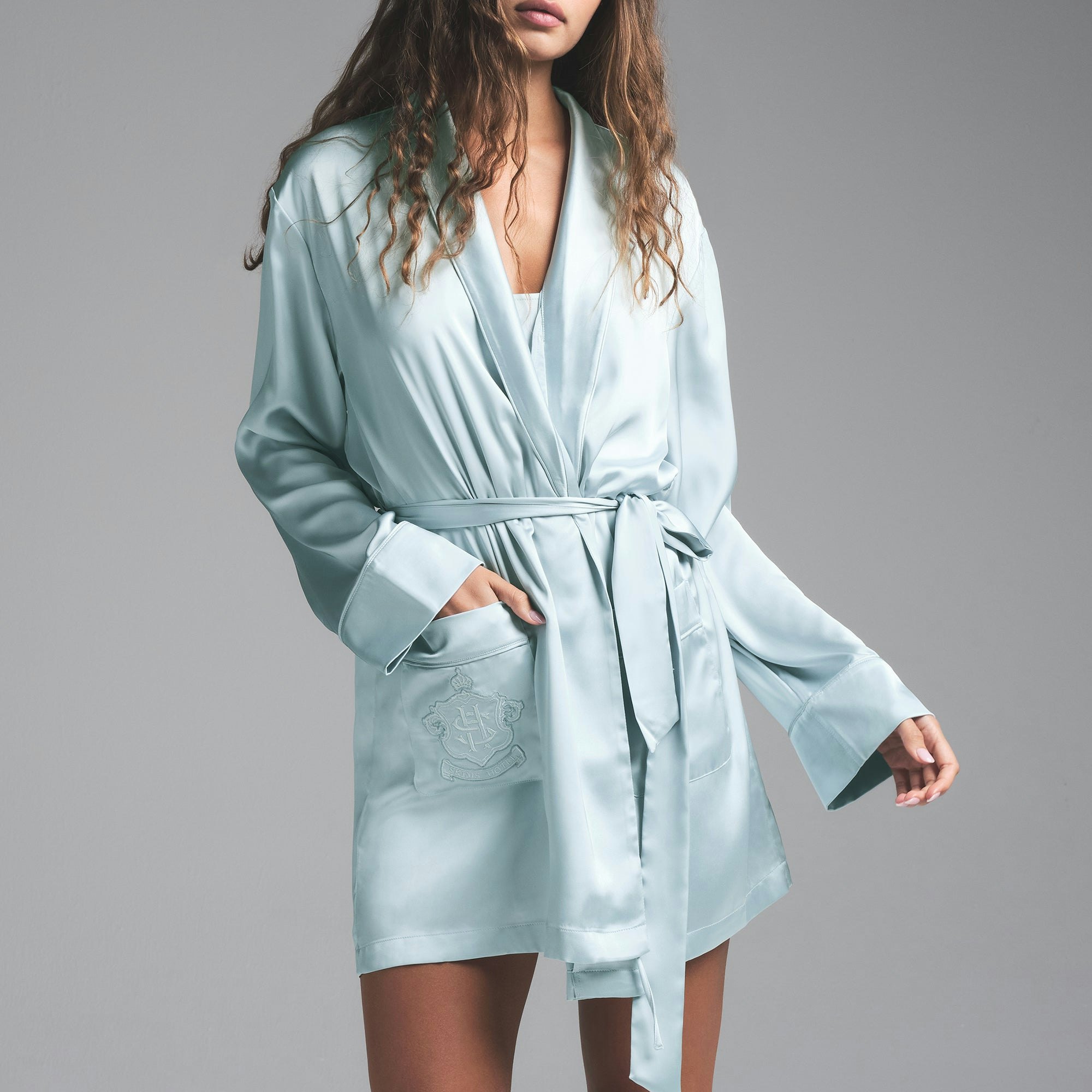 SKIMS HOTEL SHINE ROBE | FROST ON A MODEL SIDE VIEW