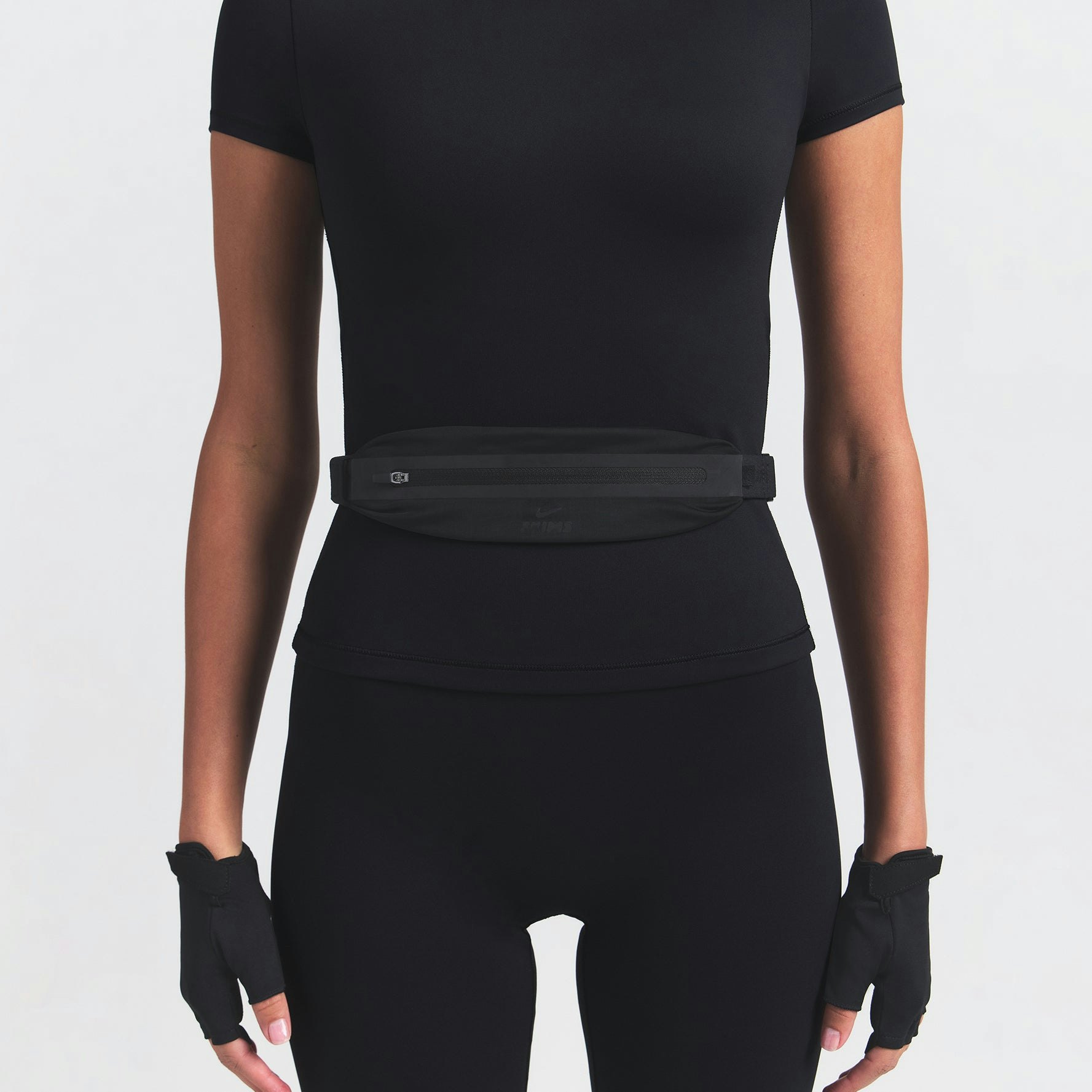 NikeSKIMS SLIM WAISTPACK | OBSIDIAN ON A MODEL FRONT VIEW @ | FOCUS: 0.0, 1.0, 0.9