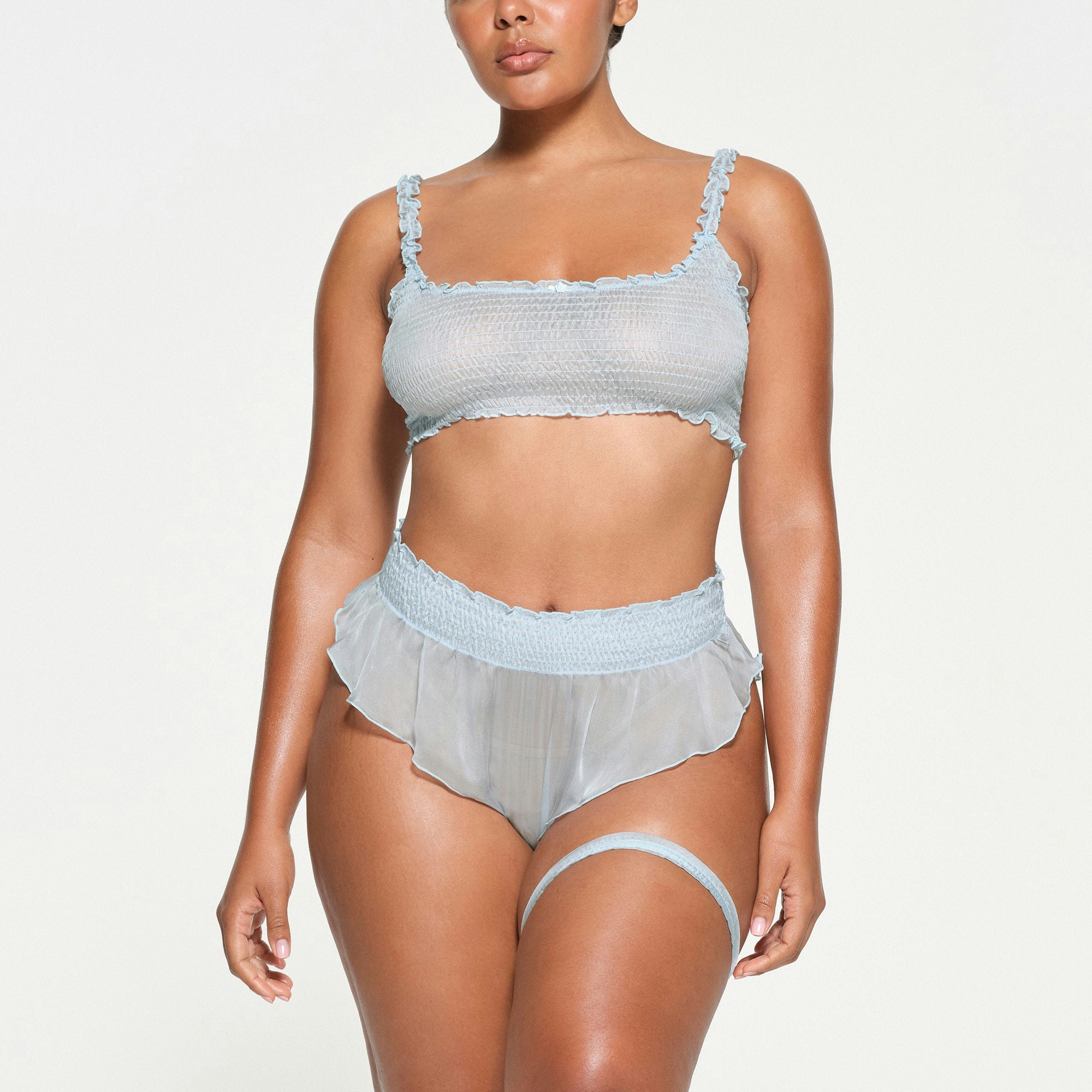 SKIMS ROMANCE SMOCKED GARTER | CELESTE ON A MODEL FRONT VIEW