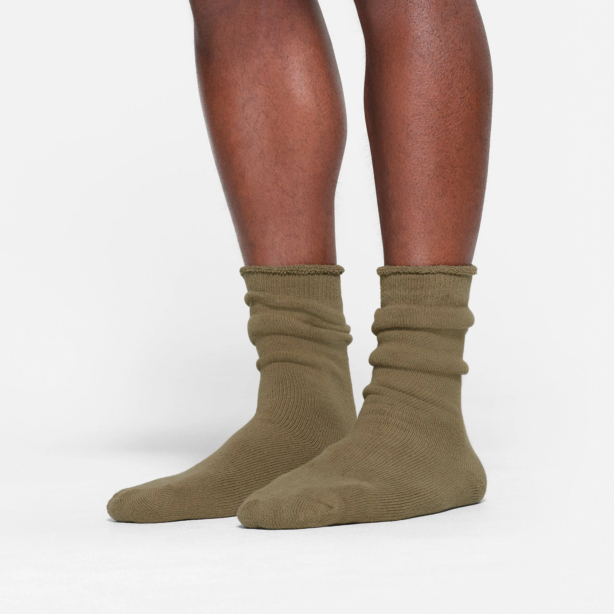 MENS LOUNGE SOCK WORN BY A MODEL IN SIDE VIEW