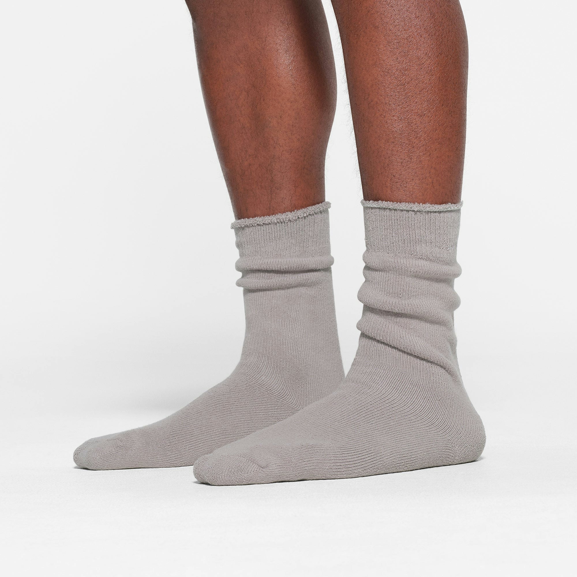 MENS LOUNGE SOCK WORN BY A MODEL IN SIDE VIEW