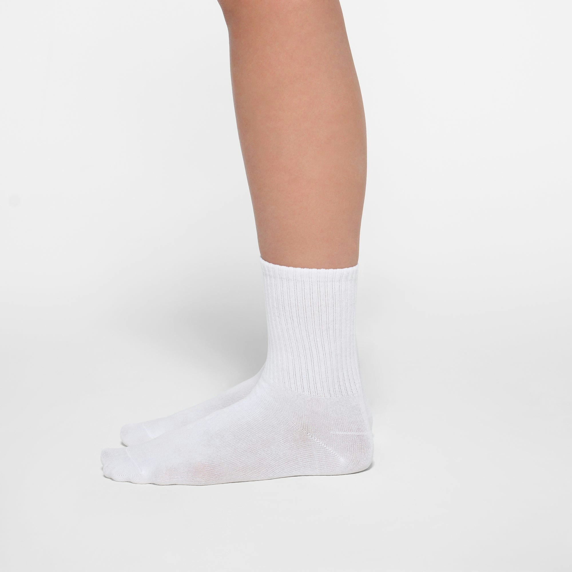 SPORT CREW SOCK 3-PACK | CORE MULTI ON A MODEL SIDE VIEW