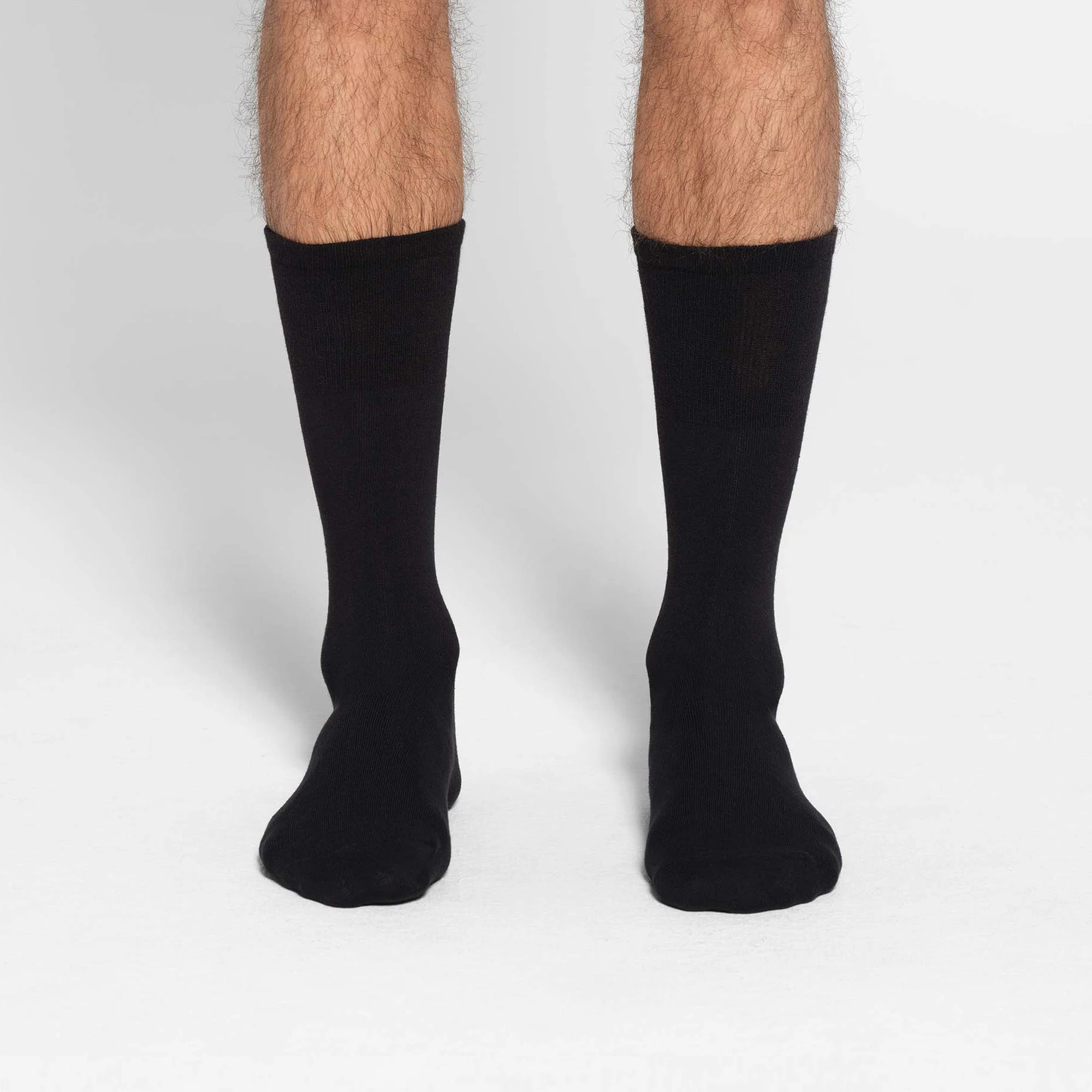 MENS DAY SOCK 3-PACK | OBSIDIAN ON A MODEL FRONT VIEW