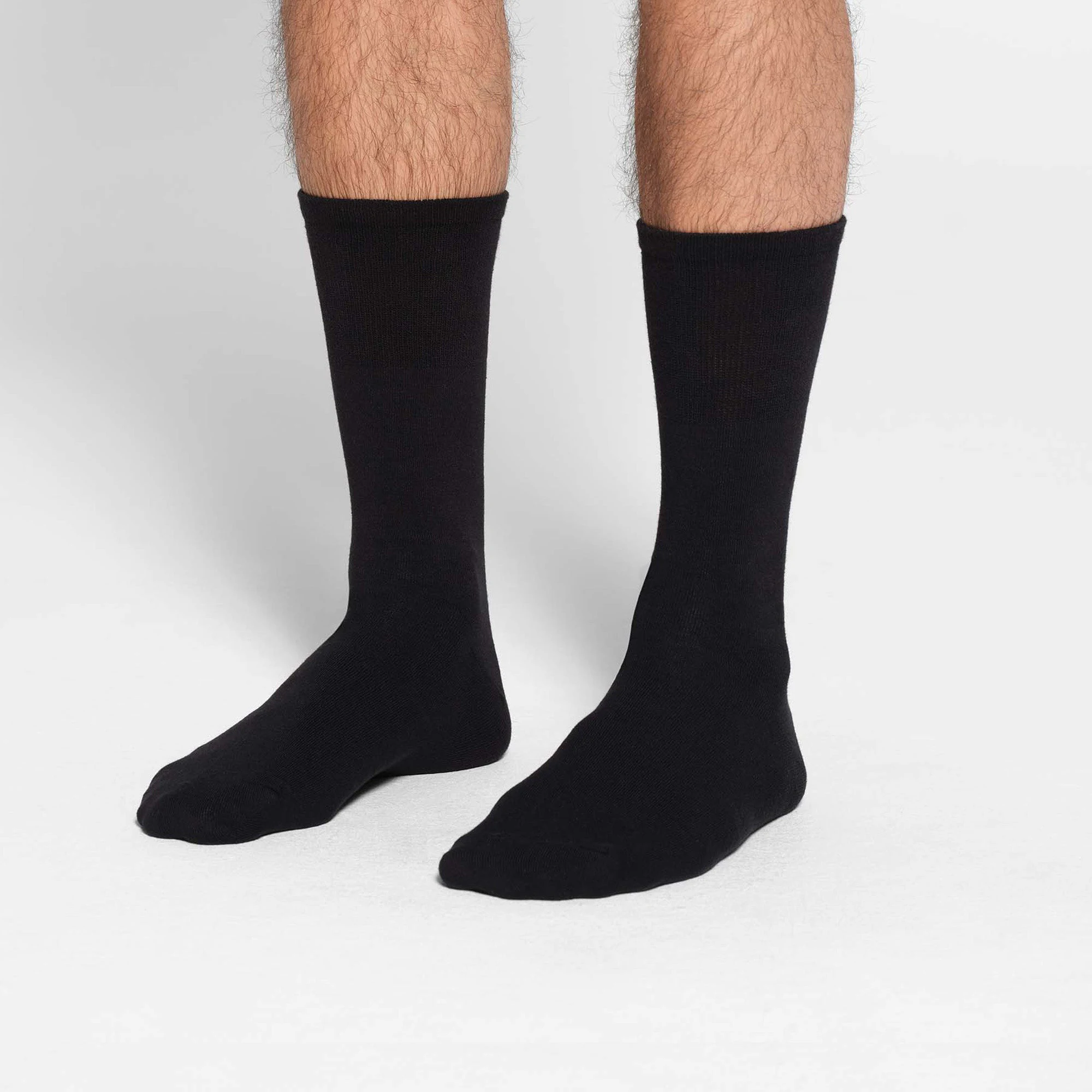 MENS DAY SOCK 3-PACK | OBSIDIAN ON A MODEL SIDE VIEW