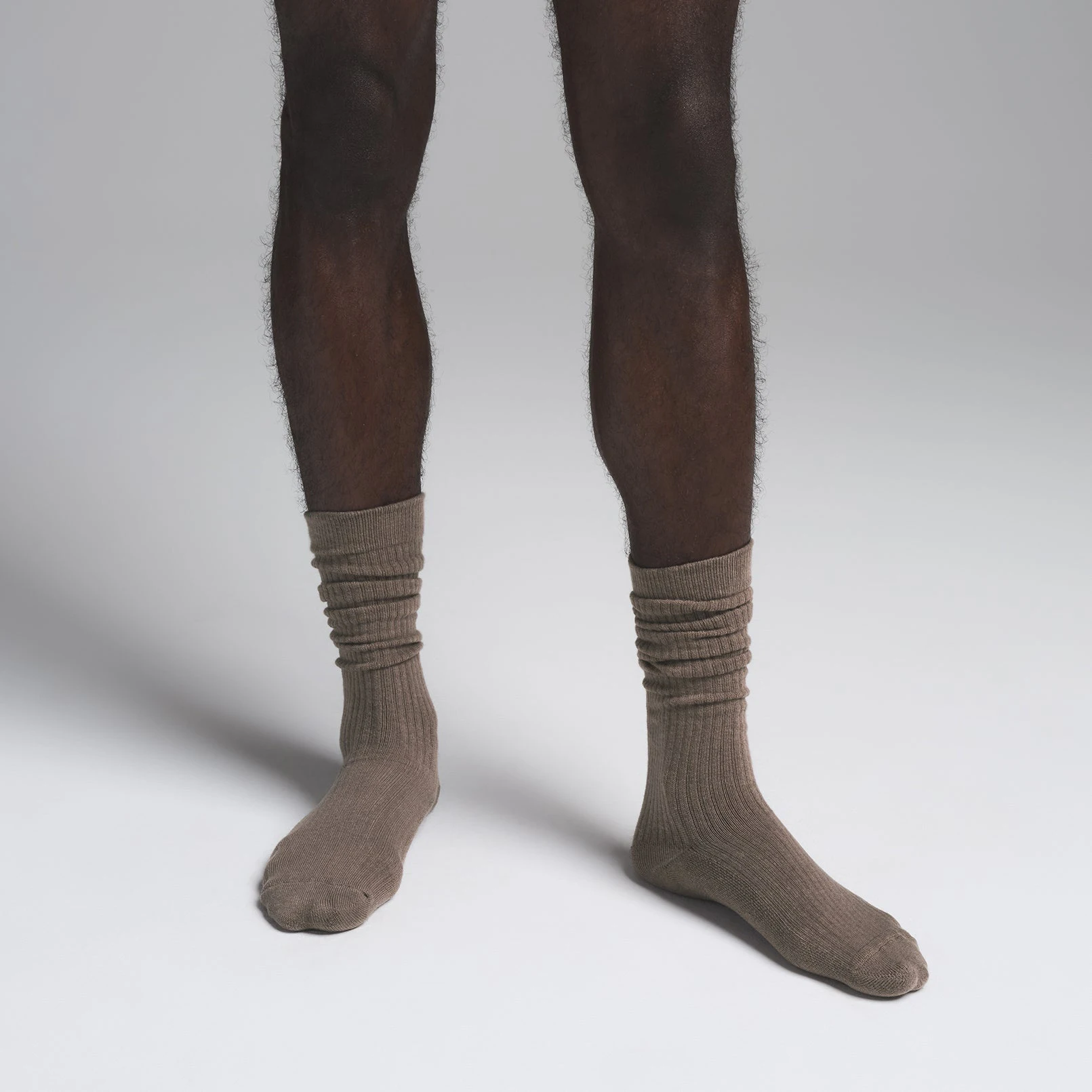 MENS SLOUCH SOCK | TRUFFLE ON A MODEL SIDE VIEW  | FOCUS: 0.0, 1.0, 0.9