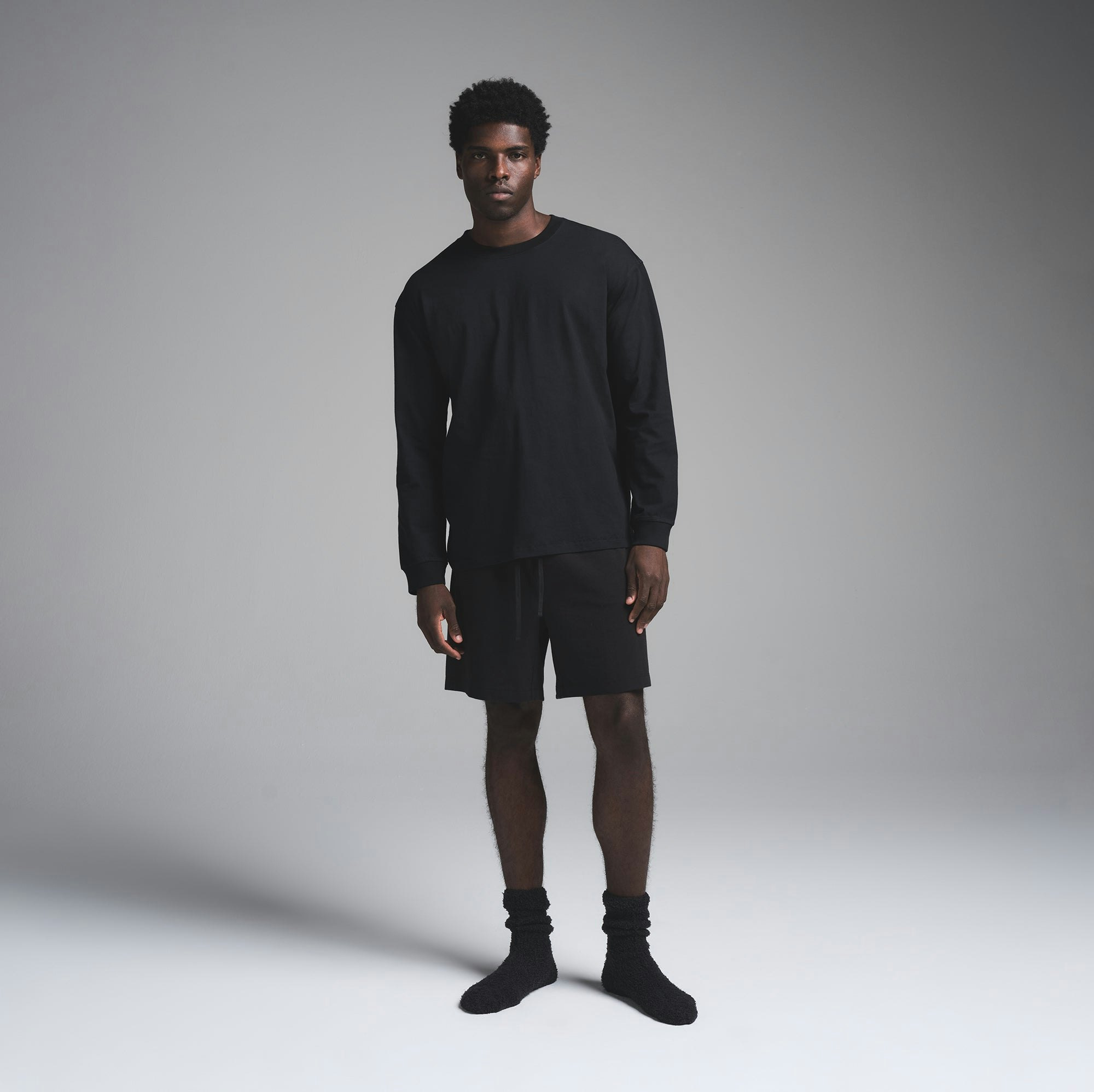 COZY KNIT MENS SOCK | ONYX ON A MODEL FRONT VIEW | FOCUS: 0.0, 1.0, 0.9