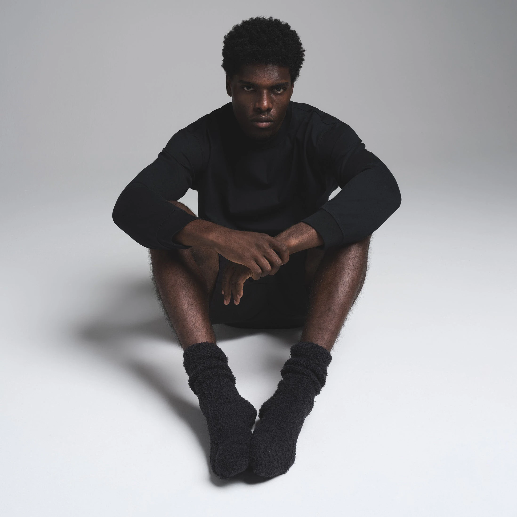 COZY KNIT MENS SOCK | ONYX ON A MODEL FRONT VIEW