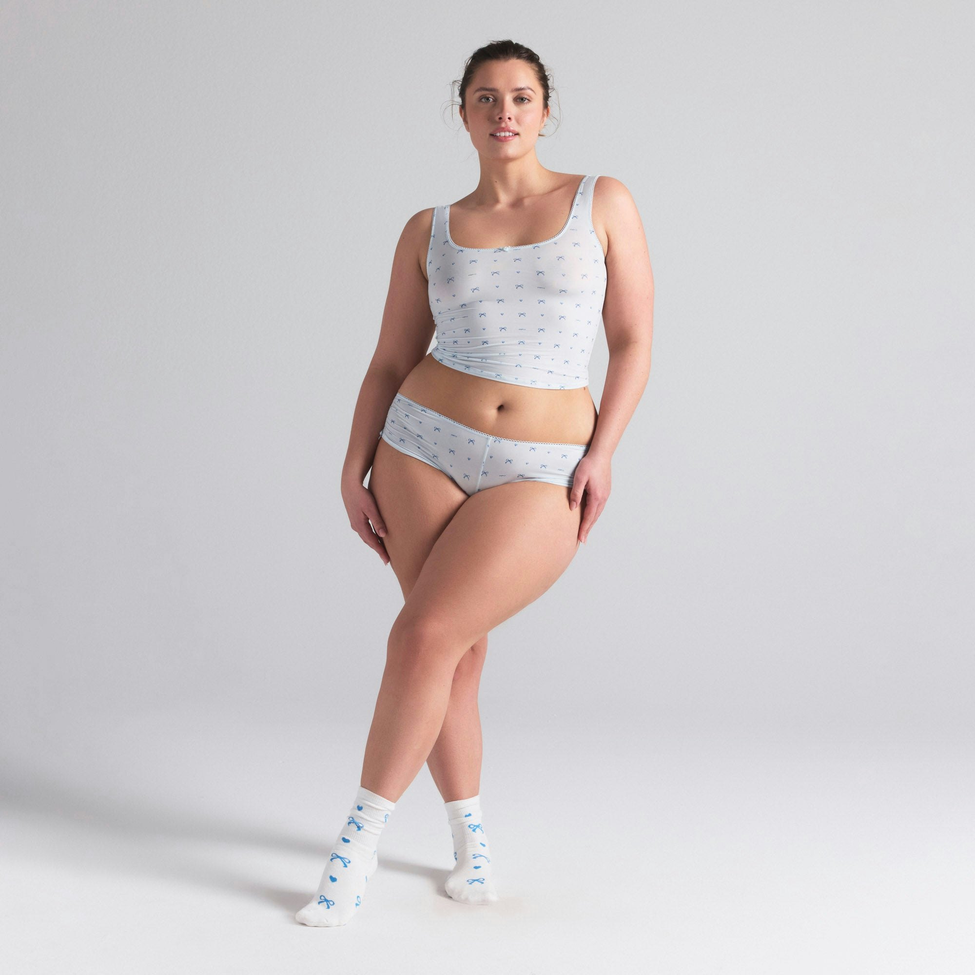 WEDDING SOCK 2-PACK | MARBLE AND CLOUD BOW PRINT ON A MODEL FRONT VIEW | FOCUS: 0.0, 1.0, 0.9