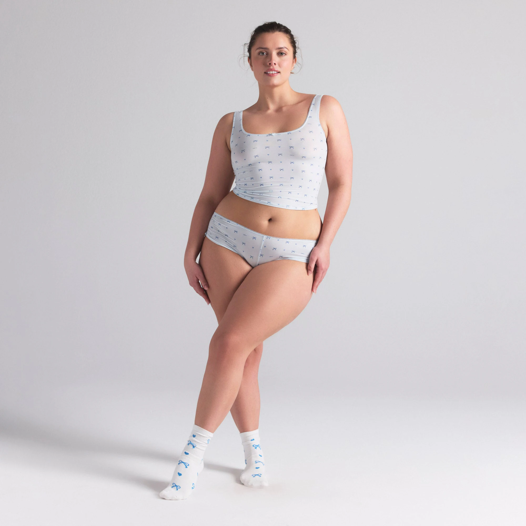 WEDDING SOCK 2-PACK | MARBLE AND CLOUD BOW PRINT ON A MODEL FRONT VIEW | FOCUS: 0.0, 1.0, 0.9