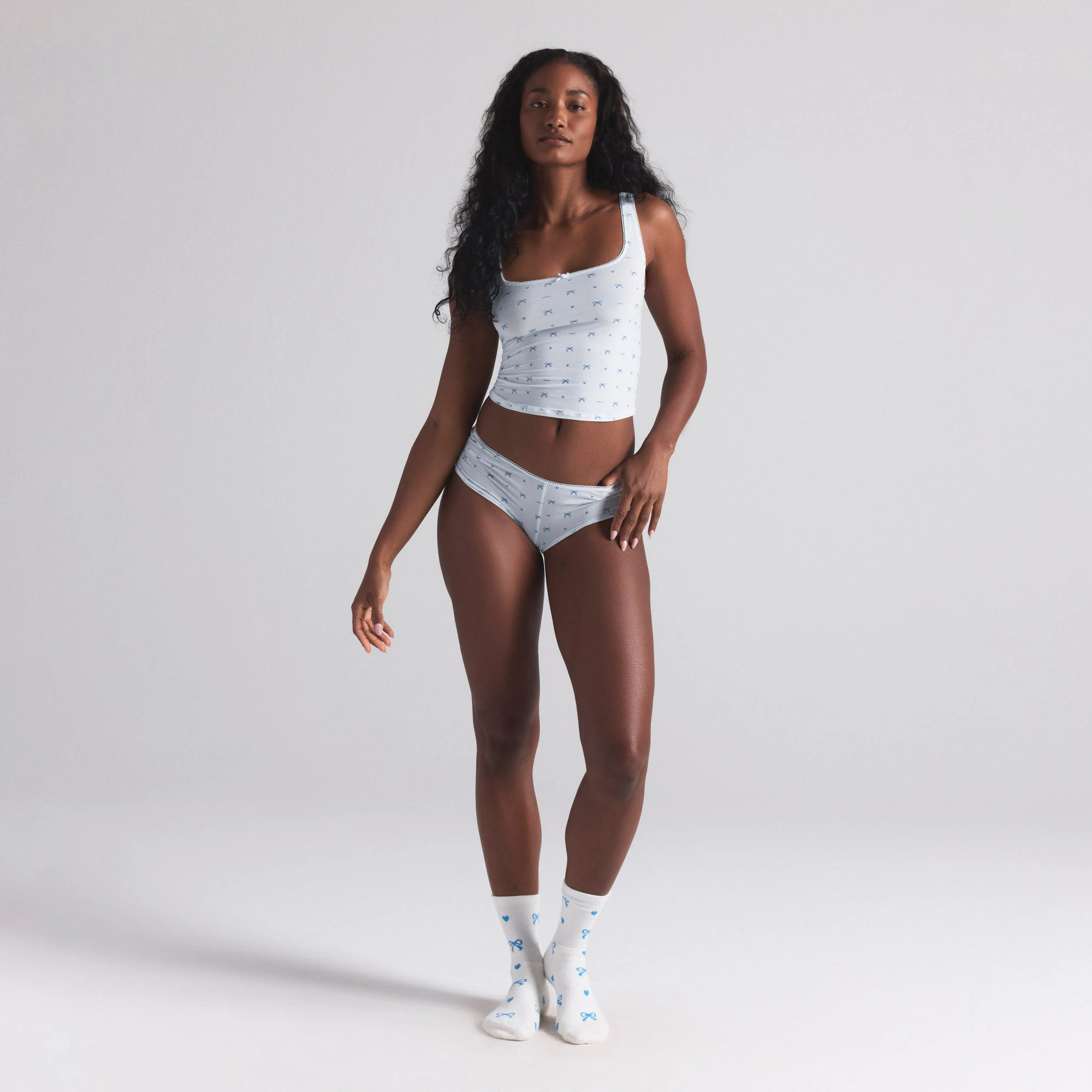 WEDDING SOCK 2-PACK | MARBLE AND CLOUD BOW PRINT ON A MODEL FRONT VIEW | FOCUS: 0.0, 1.0, 0.9