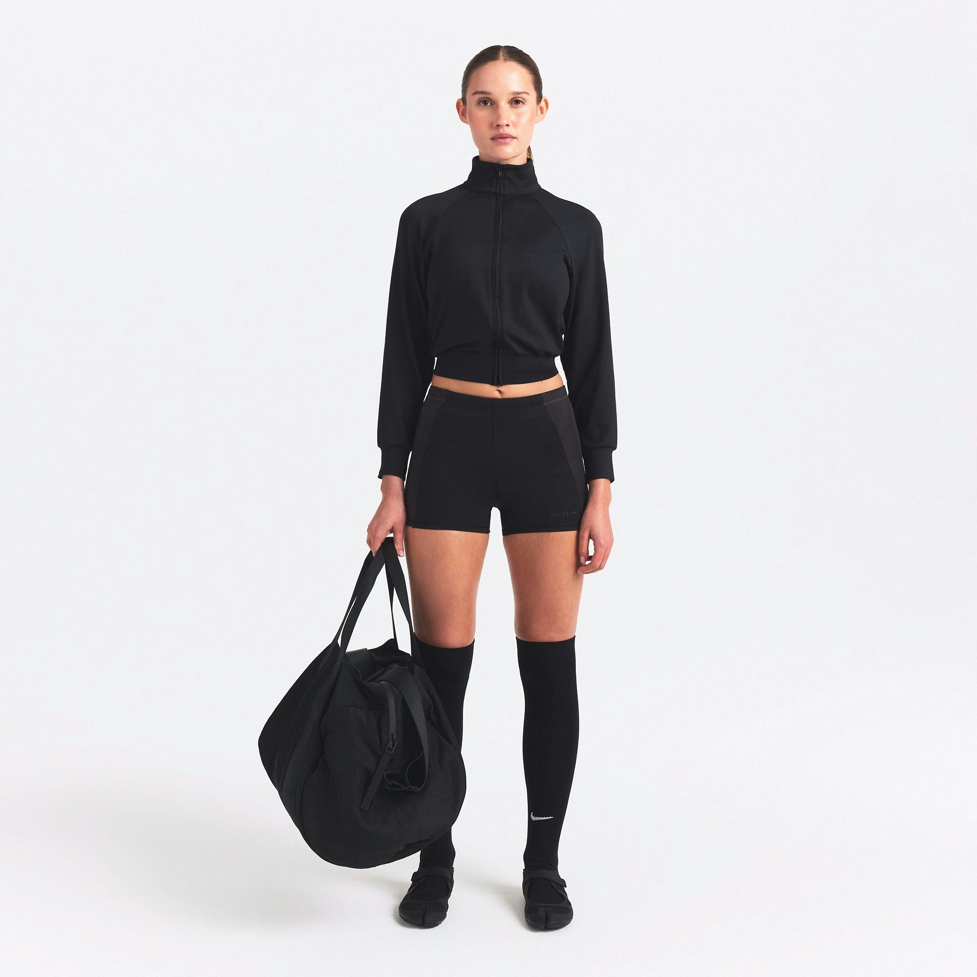 NikeSKIMS MATTE AND SHINE DRAWCORD 2" SHORT | OBSIDIAN/IGNEOUS ON A MODEL FRONT VIEW @ | FOCUS: 0.0, 1.0, 0.9