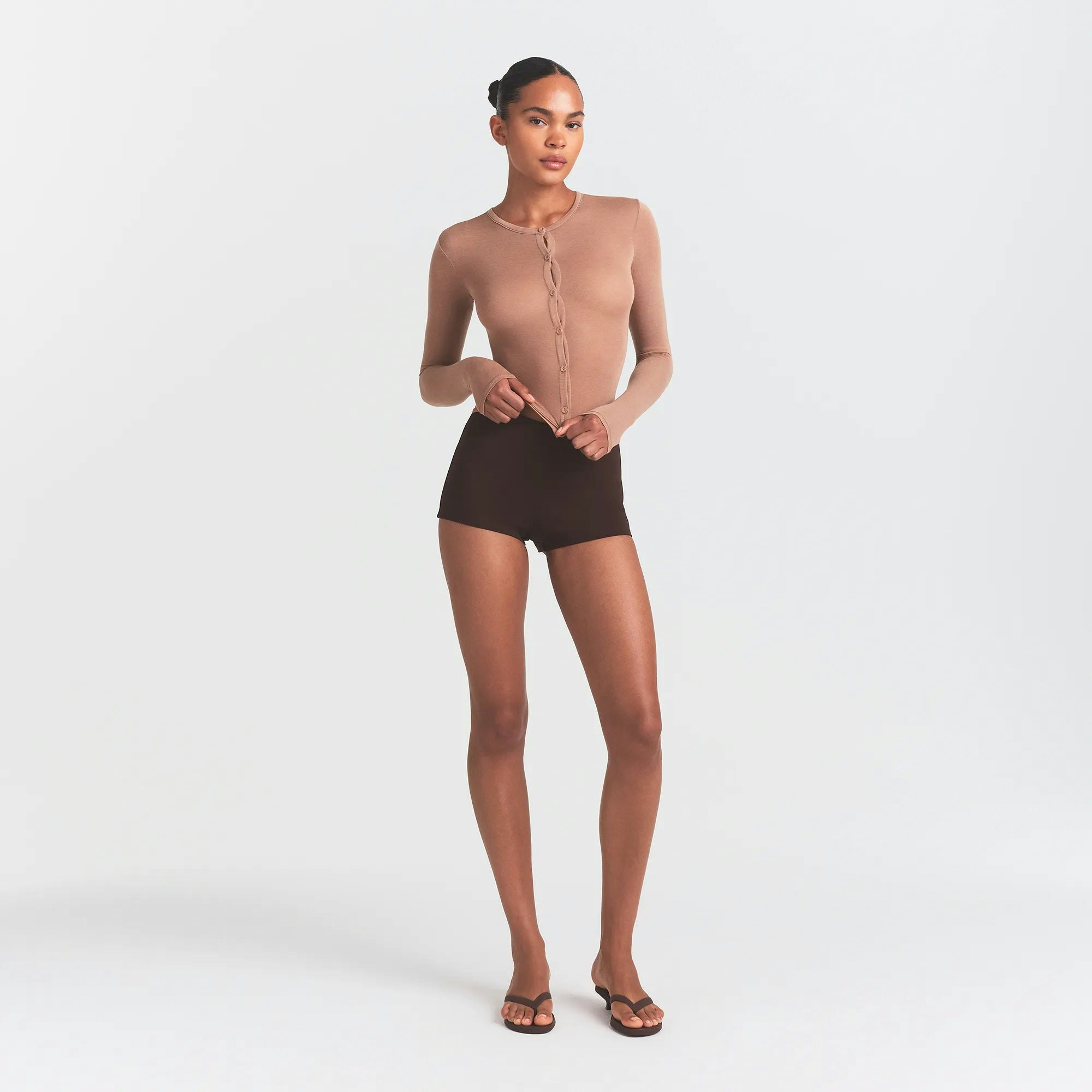 THE ESSENTIAL COLLECTION HIGH-WAISTED HOT SHORT | ESPRESSO ON A MODEL FRONT VIEW @ | FOCUS: 0.0, 1.0, 0.9