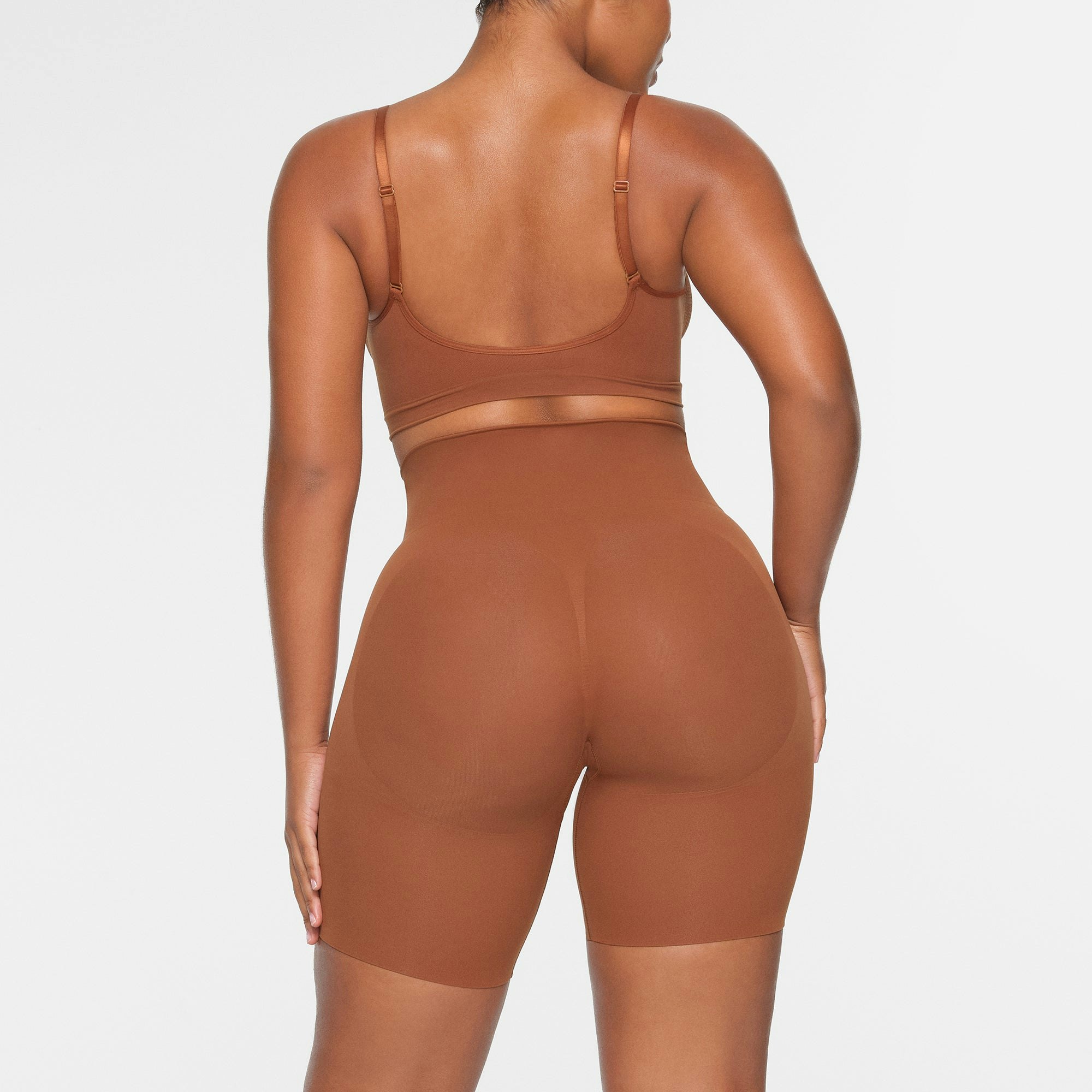 BUTT ENHANCING SHORT ON A MODEL BACK VIEW