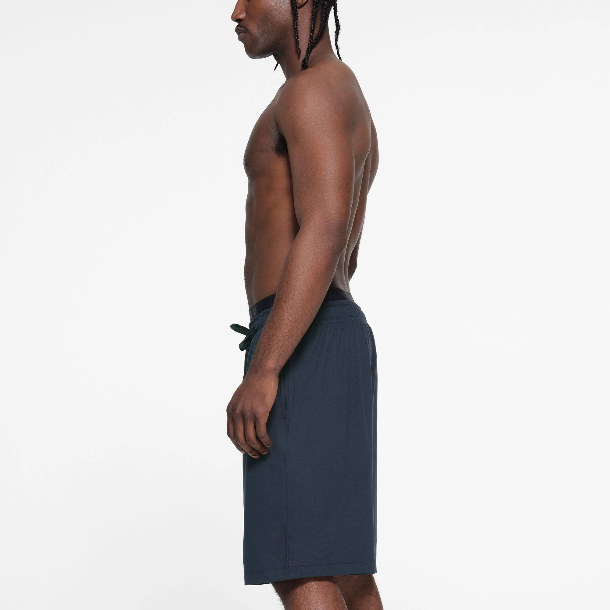 OUTDOOR JERSEY MENS RELAXED SHORT | MIDNIGHT BLUE ON A MODEL SIDE VIEW