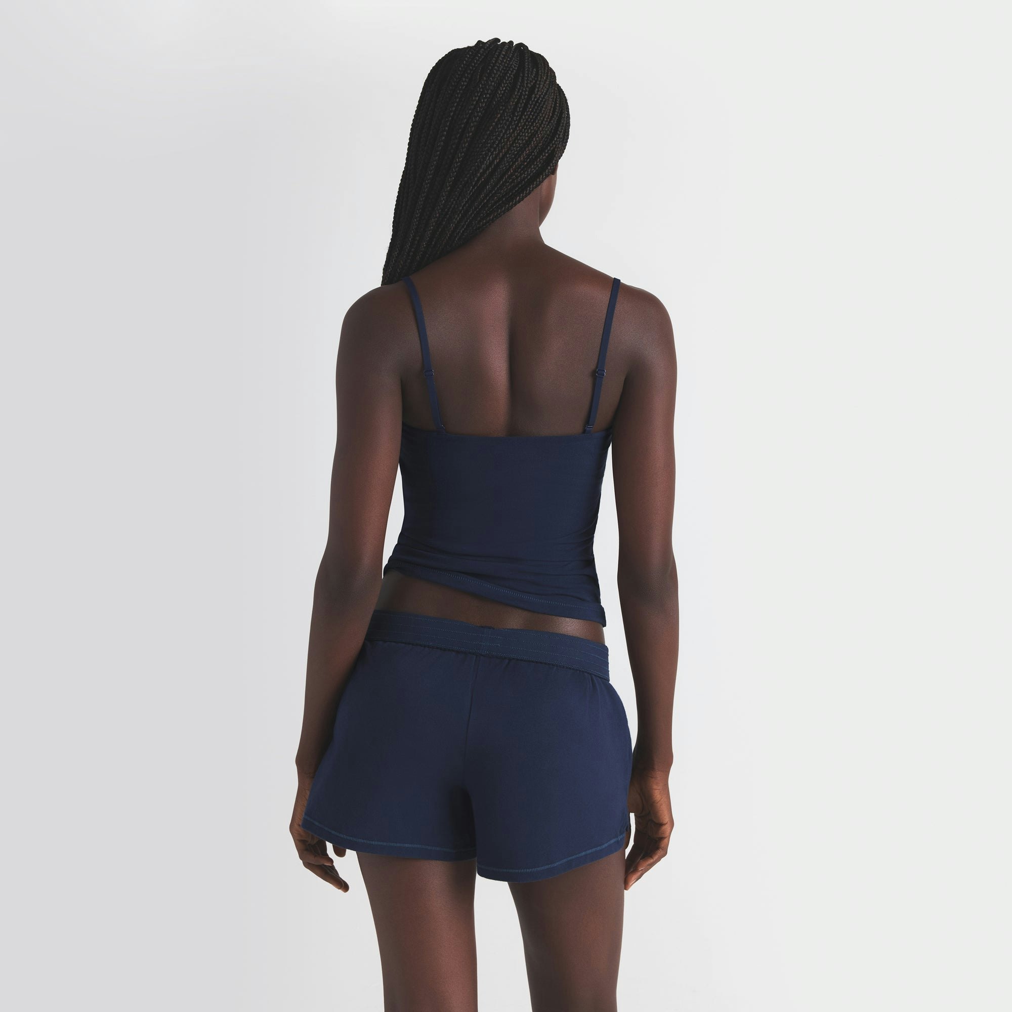 COTTON JERSEY SHORT | NAVY ON A MODEL SIDE VIEW | FOCUS: 0.0, 1.0, 0.9