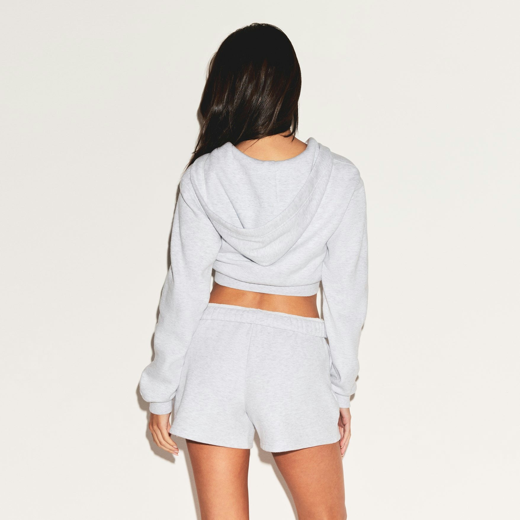 COTTON FLEECE CLASSIC SHORT | LIGHT HEATHER GREY ON A MODEL FRONT VIEW | FOCUS: 0.0, 1.0, 0.9