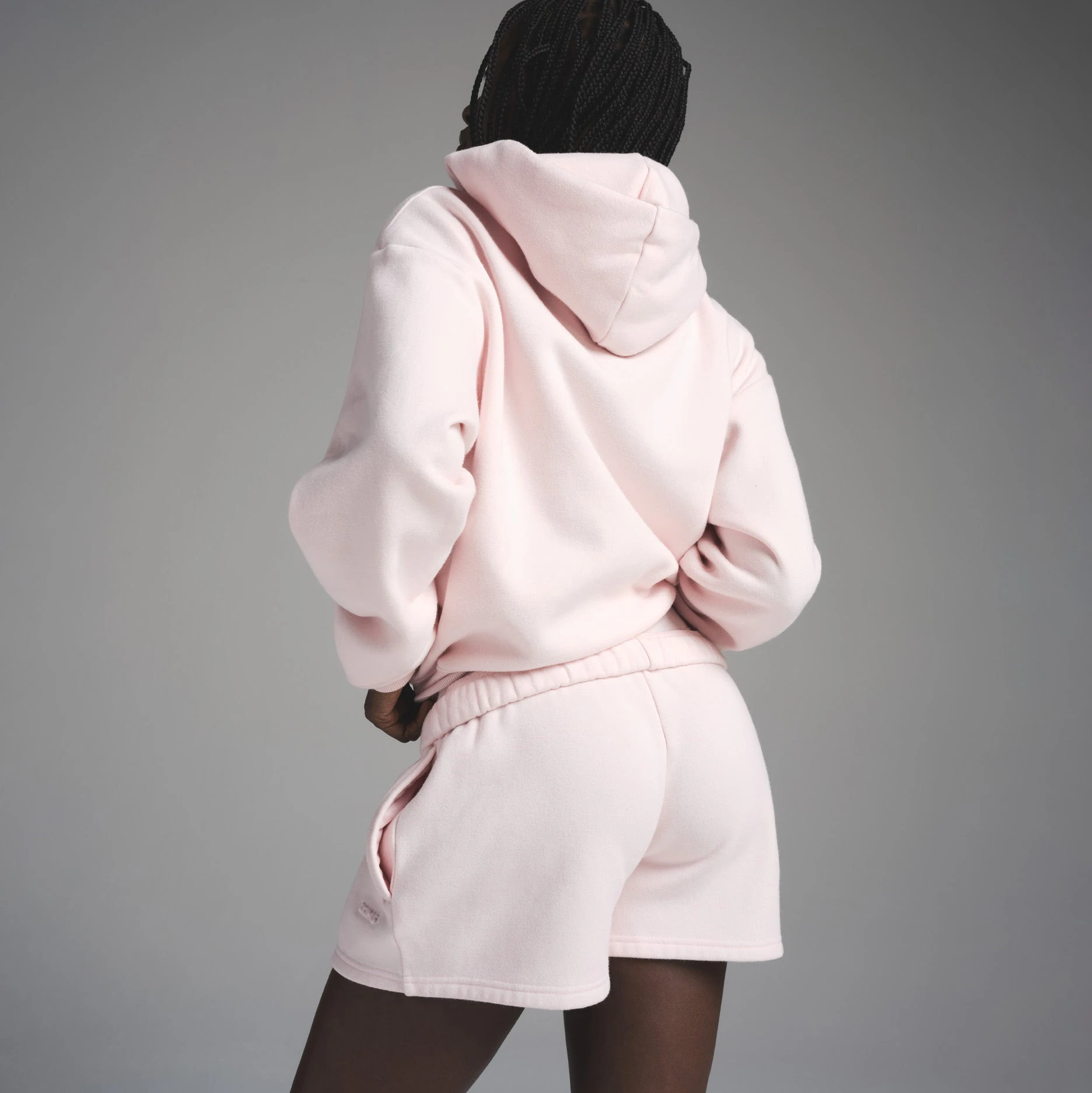 COTTON FLEECE CLASSIC SHORT | BARELY PINK ON A MODEL FRONT VIEW | FOCUS: 0.0, 1.0, 0.9
